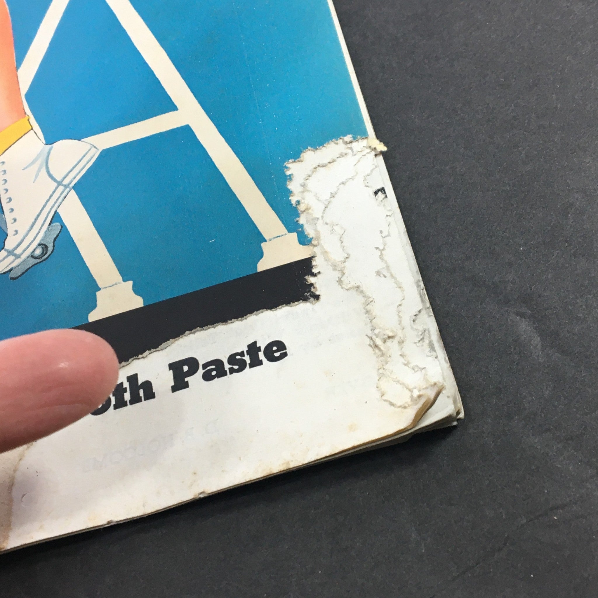 Detailed view of the edge damage on the cover of VTG Collier's Magazine March 1 1941, which reflects its vintage condition.