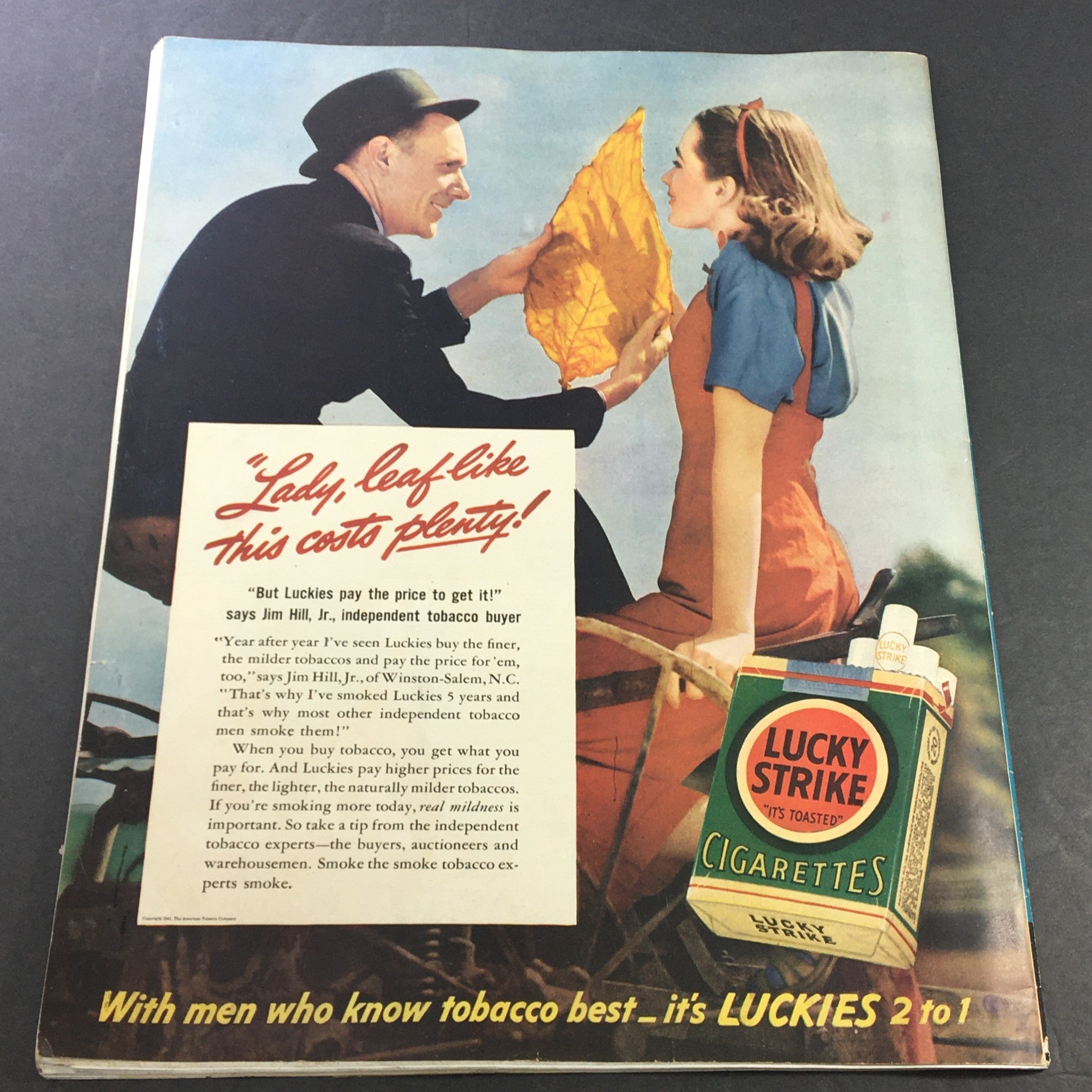 Back cover of VTG Collier's Magazine March 1 1941 showcasing a vintage advertisement for Lucky Strike Cigarettes, featuring a tobacco buyer and a model, illustrating marketing trends of the time.