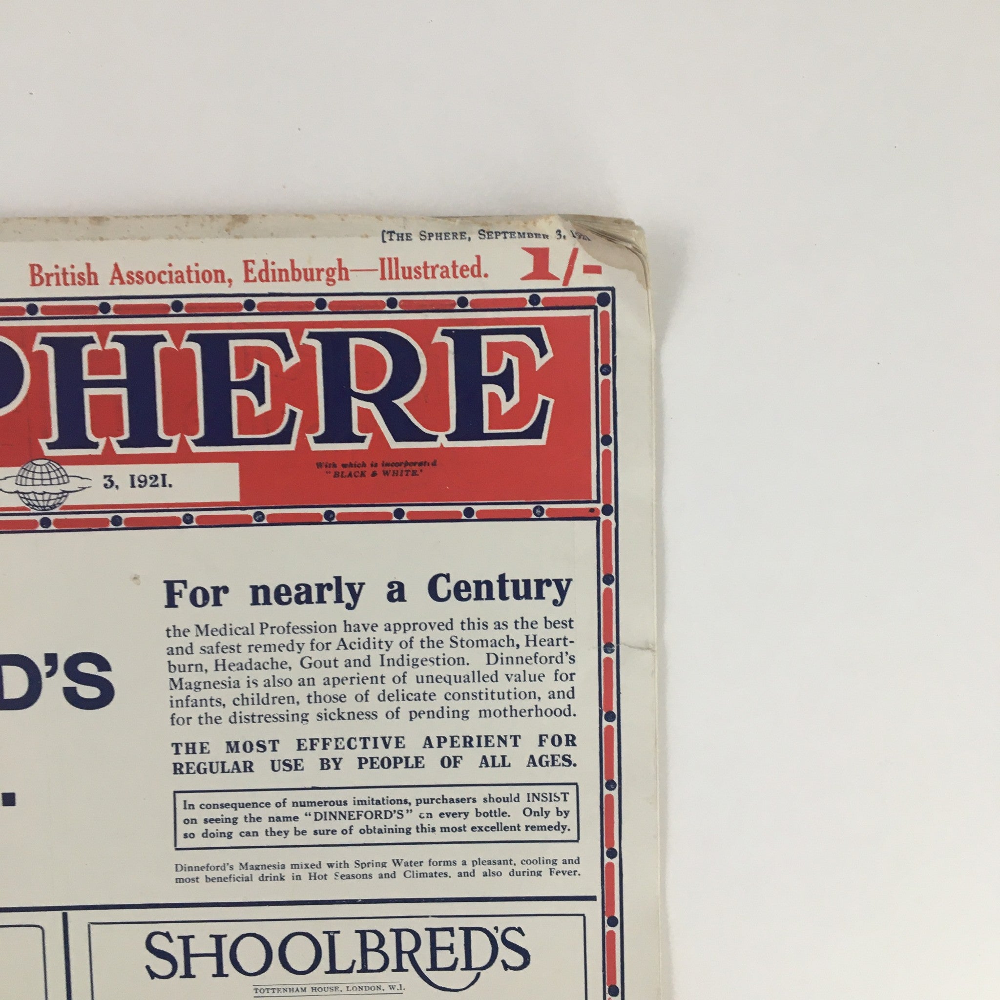 Close-up of The Sphere Newspaper dated September 3, 1921, highlighting an advertisement for Dinneford's Magnesia with historical context.