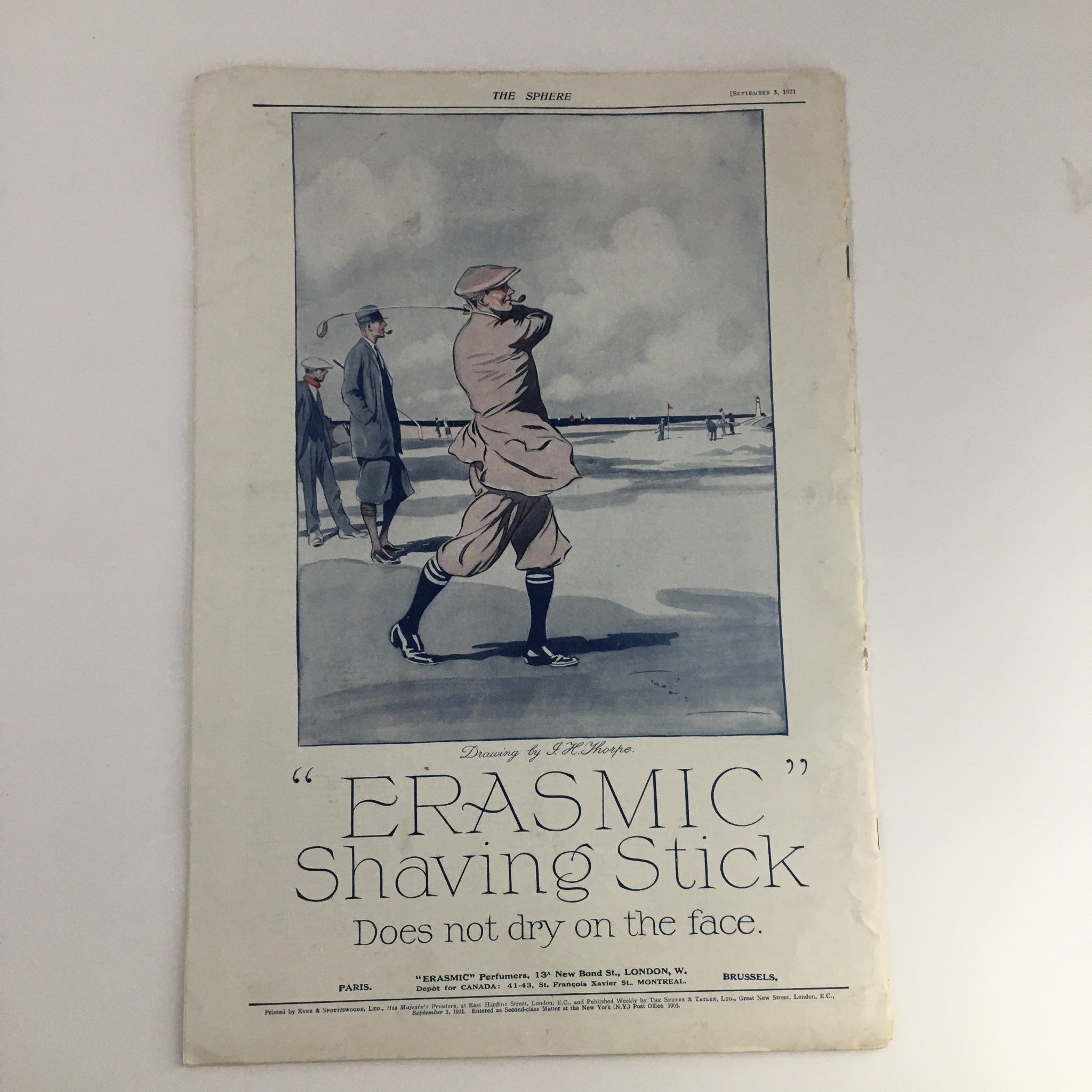 The Sphere Newspaper September 3 1921 showcasing an advertisement for 'ERASMIC' Shaving Stick, illustrated with a stylish man using the product at a seaside location.