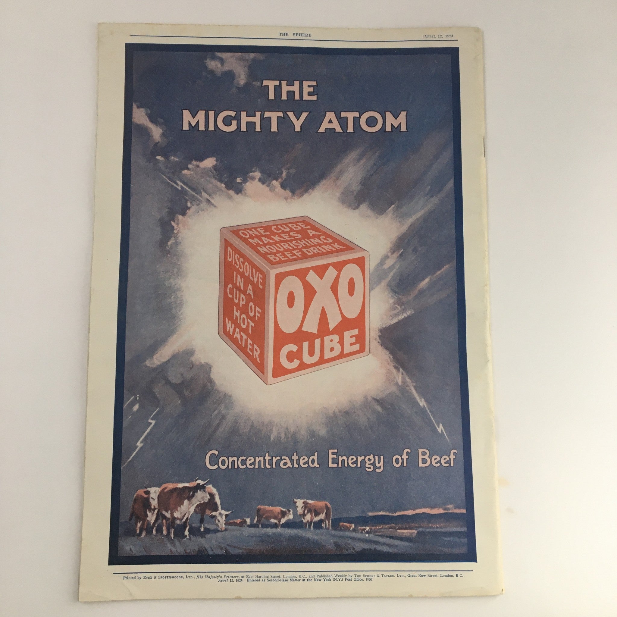 The Sphere Newspaper April 12, 1924 cover featuring a vintage advertisement for Oxo Cube, emphasizing its concentrated energy of beef, with cows grazing in the background.