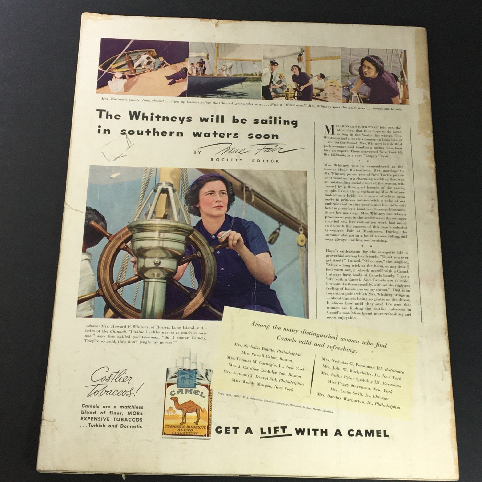 Back cover of VTG Photoplay Magazine December 1937 with an article about the Whitneys sailing and an advertisement for Camel Cigarettes.