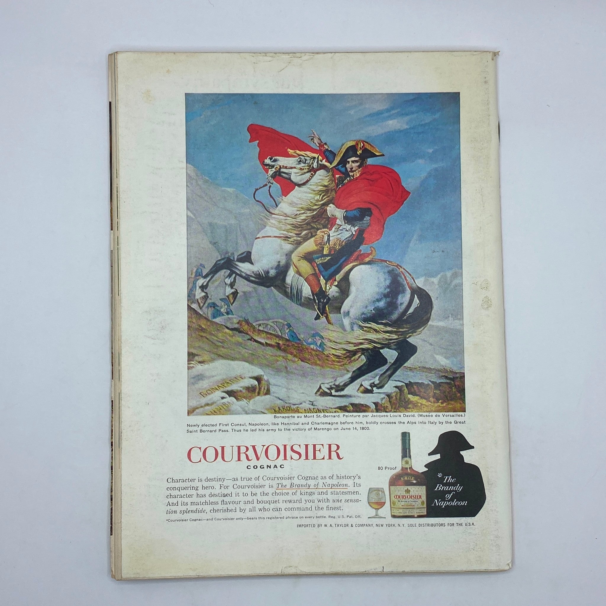 Back cover advertisement of Courvoisier Cognac featured in The New Yorker Complete Magazine from April 25, 1964, depicting a historical illustration of Napoleon on horseback.