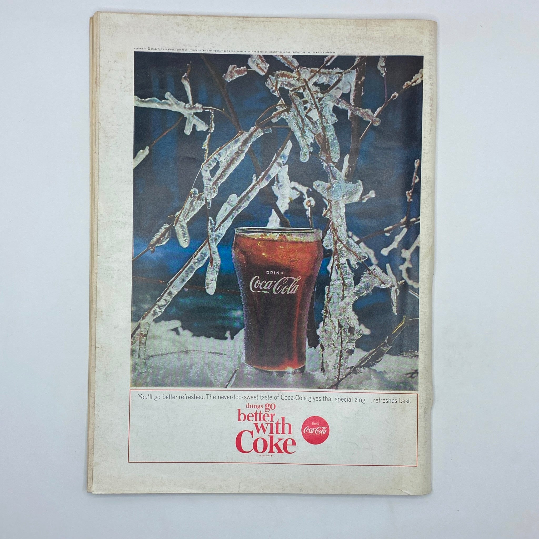 Back cover of The New Yorker Complete Magazine June 20, 1964 featuring an advertisement for Coca-Cola with a glass of drink surrounded by icy branches.