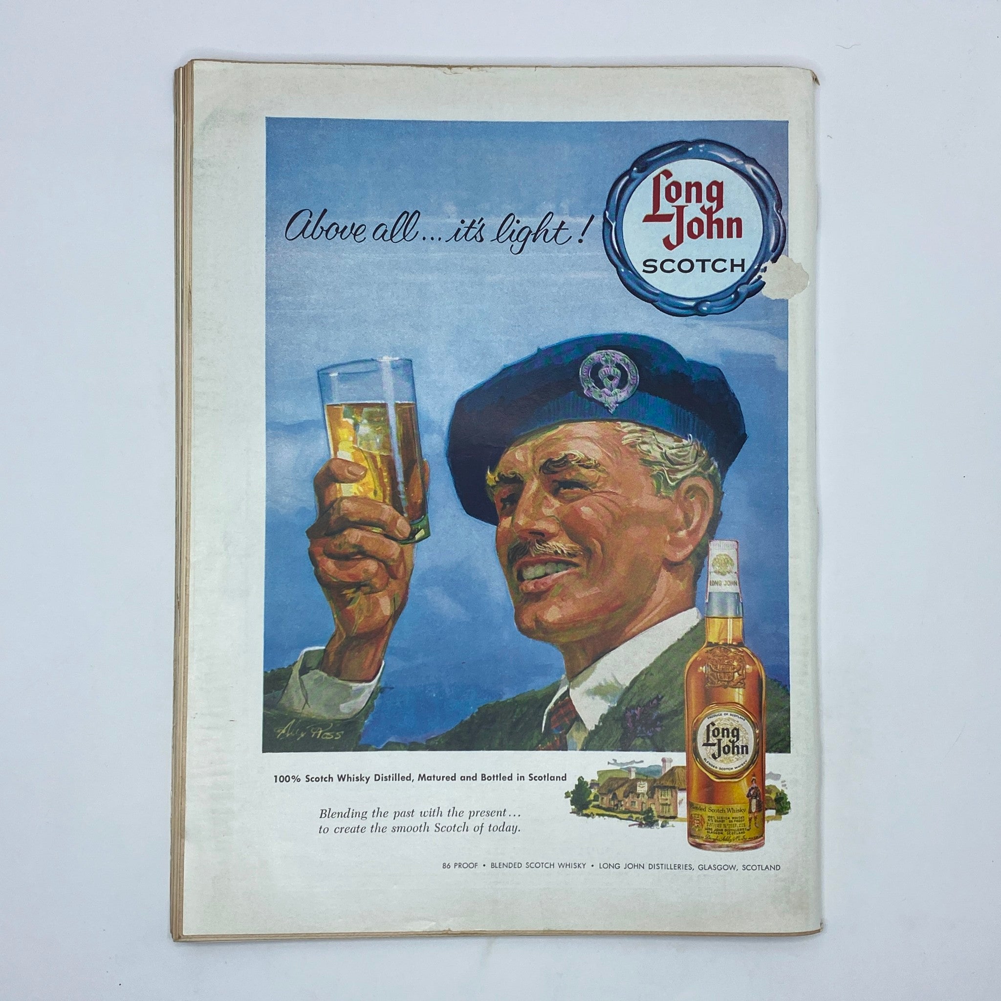 Advertisement for Long John Scotch on the back cover of The New Yorker Complete Magazine April 18, 1959 featuring a smiling man in military attire raising a glass of whisky.