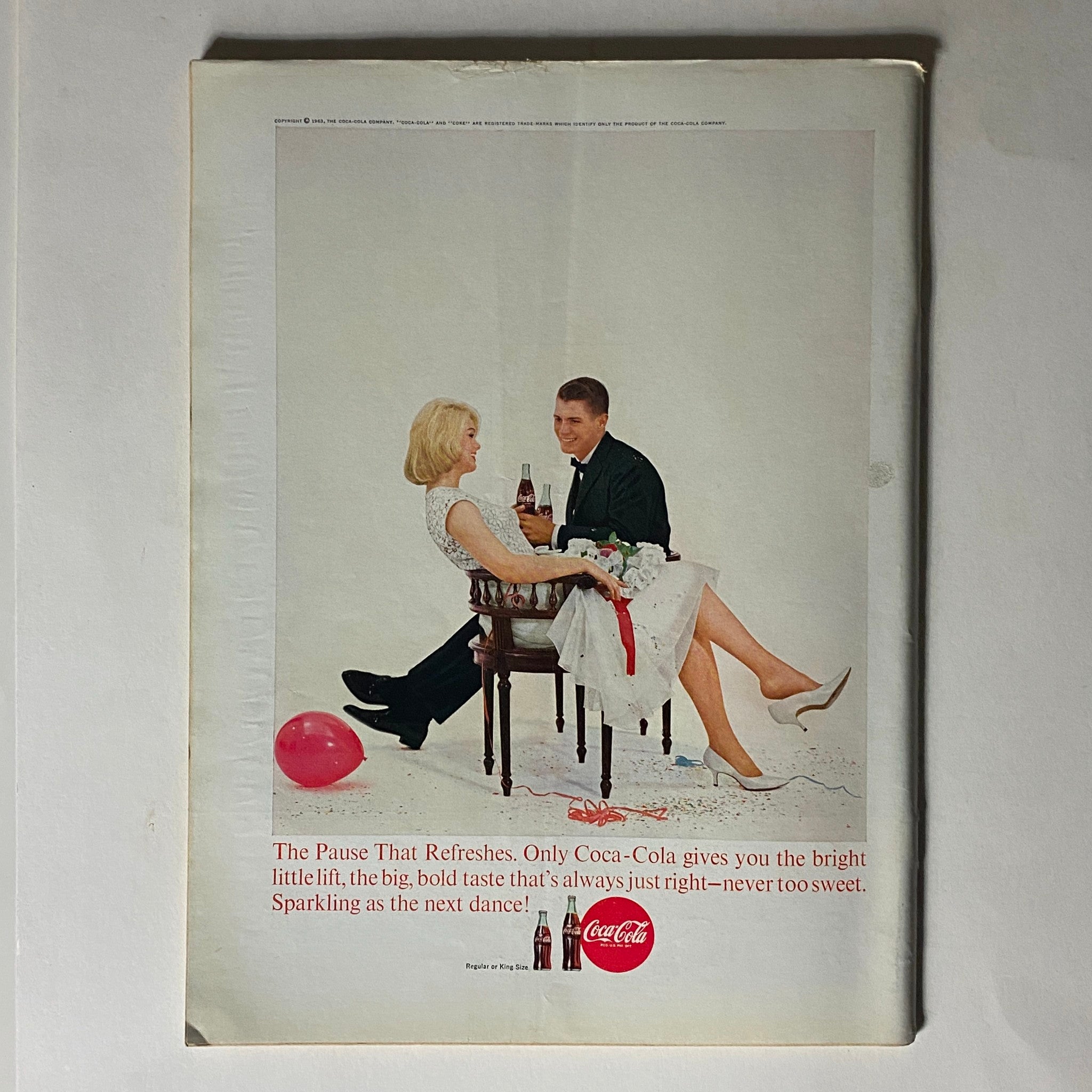 The New Yorker Complete Magazine February 2, 1963 back cover advertisement for Coca-Cola, showcasing a stylish couple enjoying drinks in a celebratory setting.