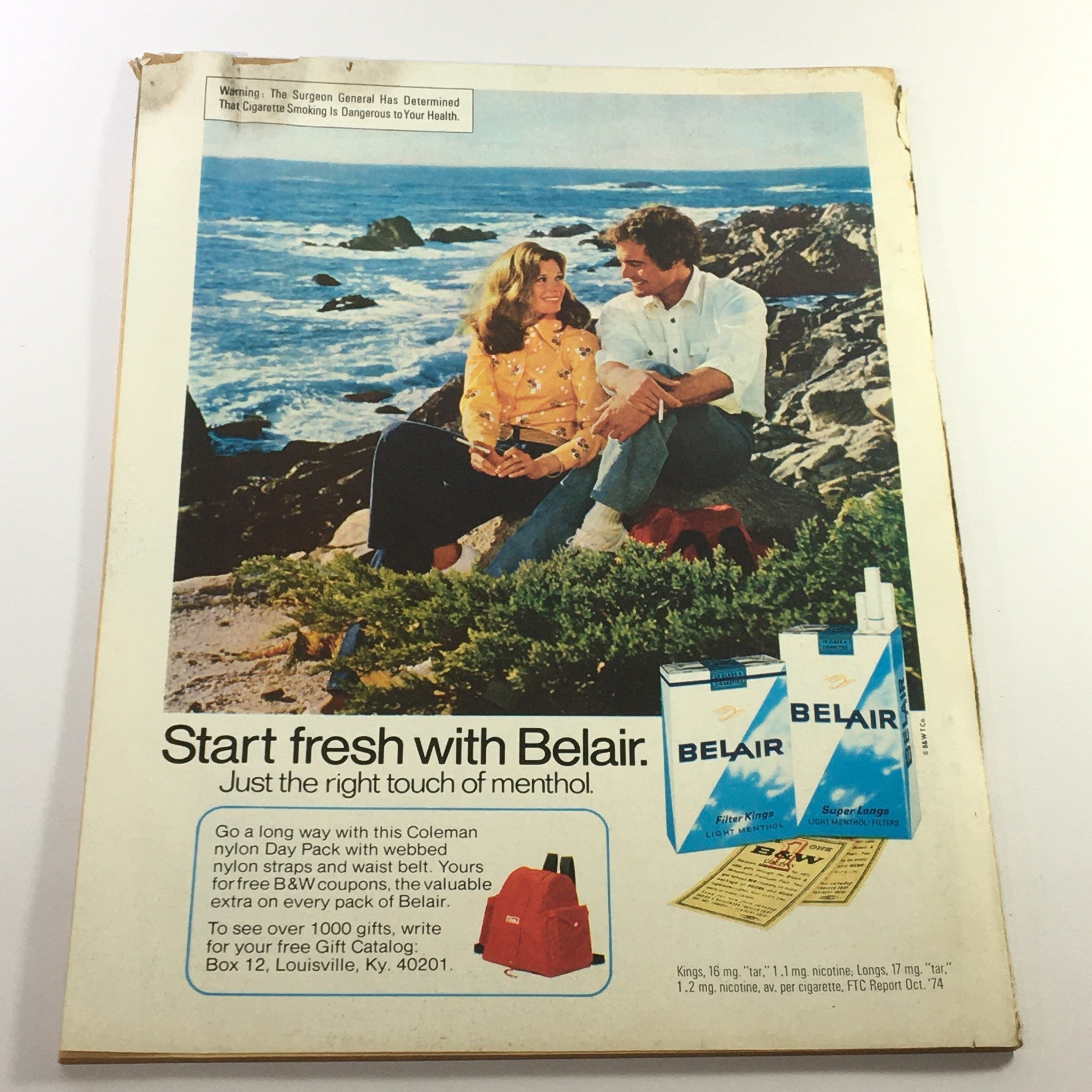 Back cover of VTG Lady's Circle Magazine June 1975 showcasing an advertisement for Belair cigarettes against a coastal backdrop.