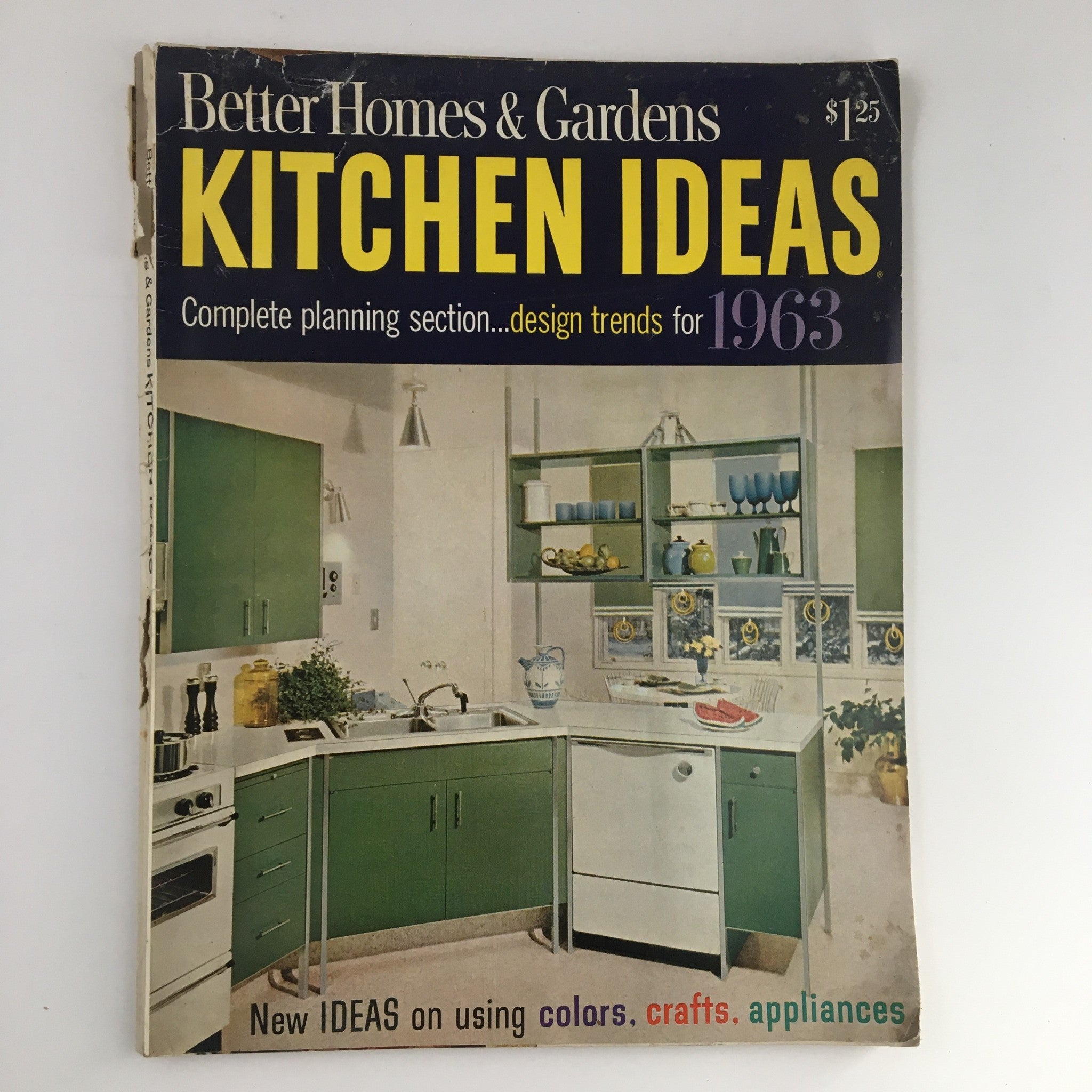 Cover of Better Homes & Gardens Magazine titled Kitchen Ideas for 1963 showcasing mid-century kitchen design with green cabinetry and modern appliances.