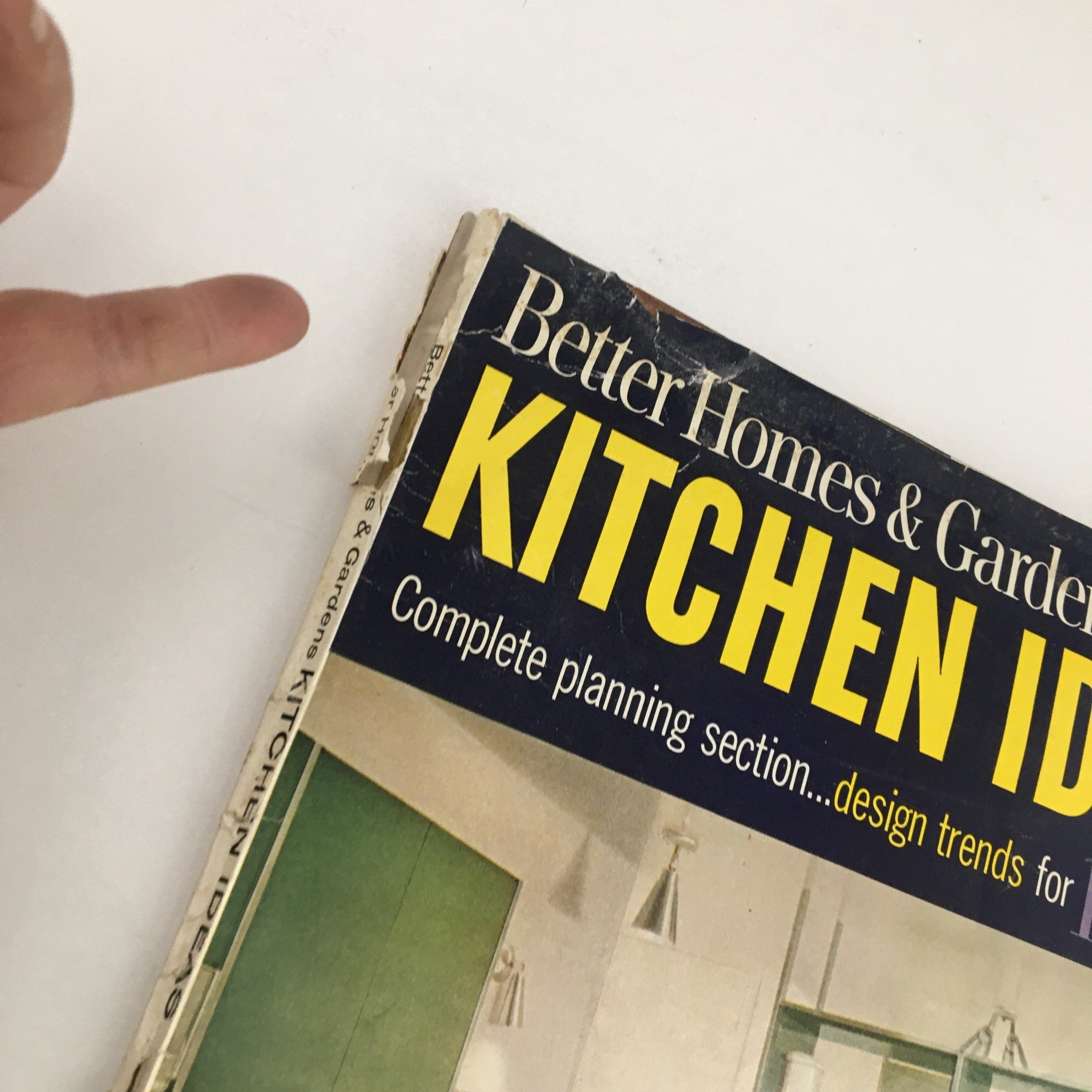 Spine detail of Better Homes & Gardens Magazine Kitchen Ideas for 1963, highlighting its vintage wear and signs of age.