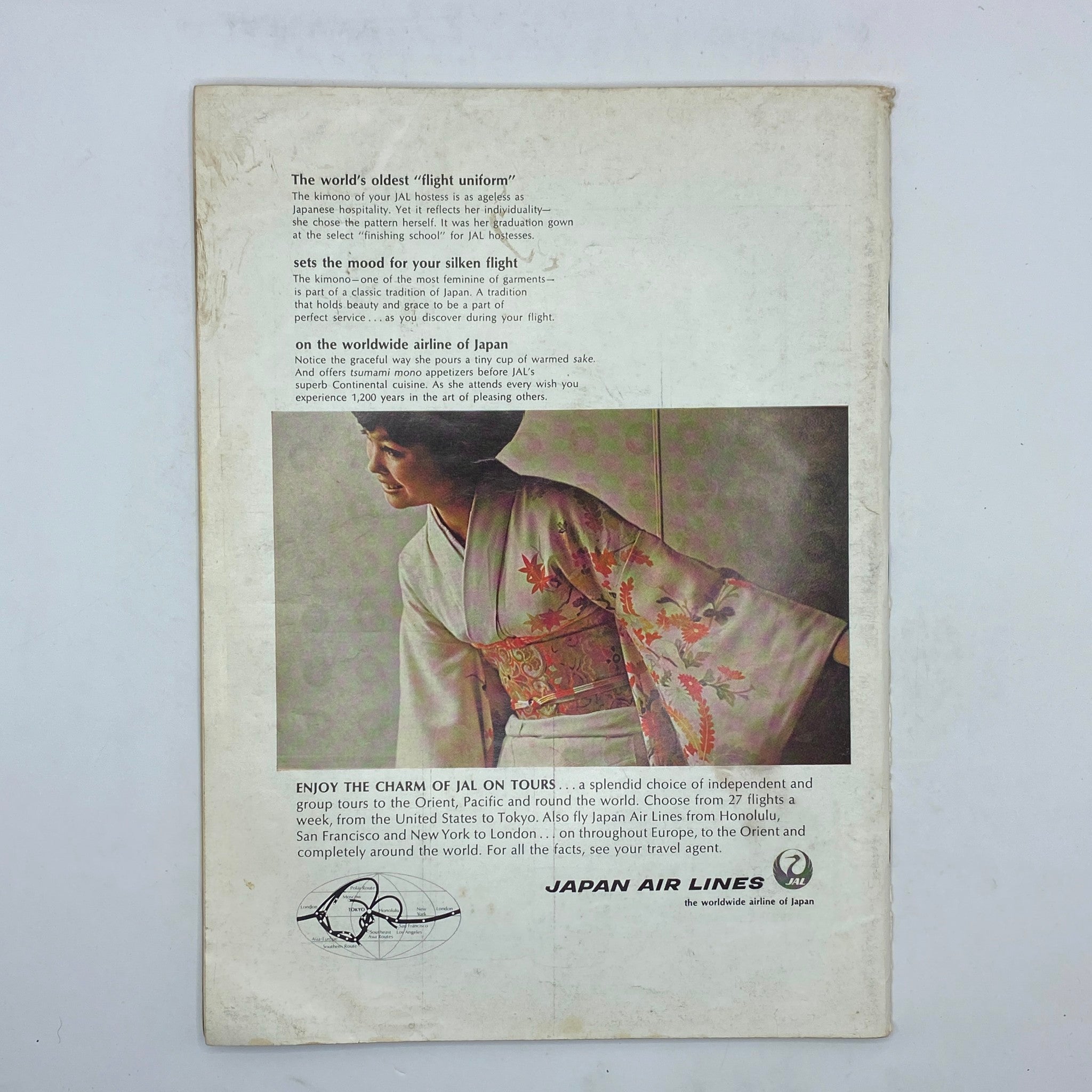 Back cover of The New Yorker Complete Magazine January 27, 1968 James Stevenson Cover No Label featuring an advertisement for Japan Air Lines. The image showcases a woman in a traditional kimono, highlighting Japanese culture and hospitality with text about the airline's services.