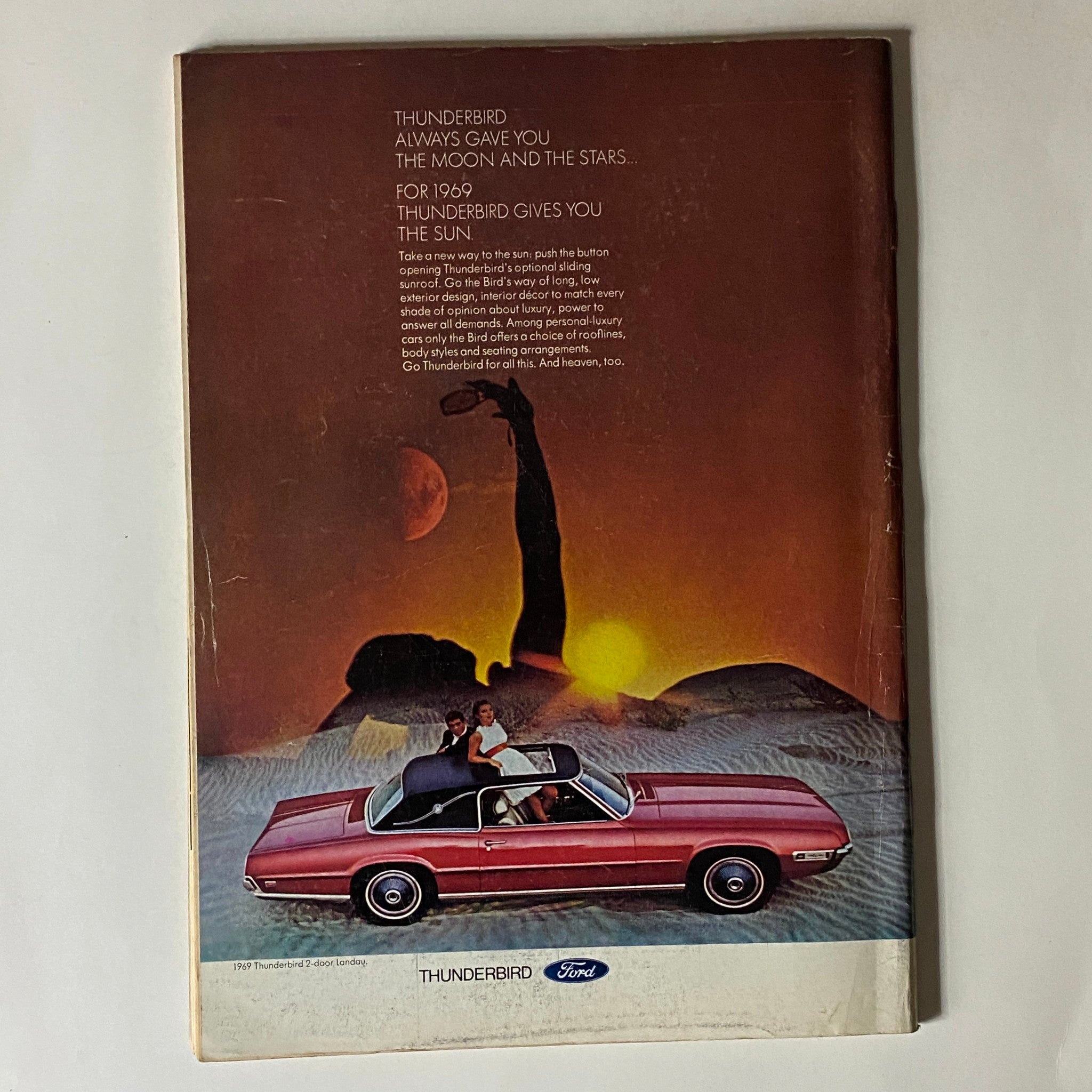 The New Yorker Complete Magazine March 8, 1969 with a Ford Thunderbird advertisement featuring a couple in a pink Thunderbird convertible against a sunset backdrop, showcasing the luxurious design and elements of the 1969 Thunderbird model.