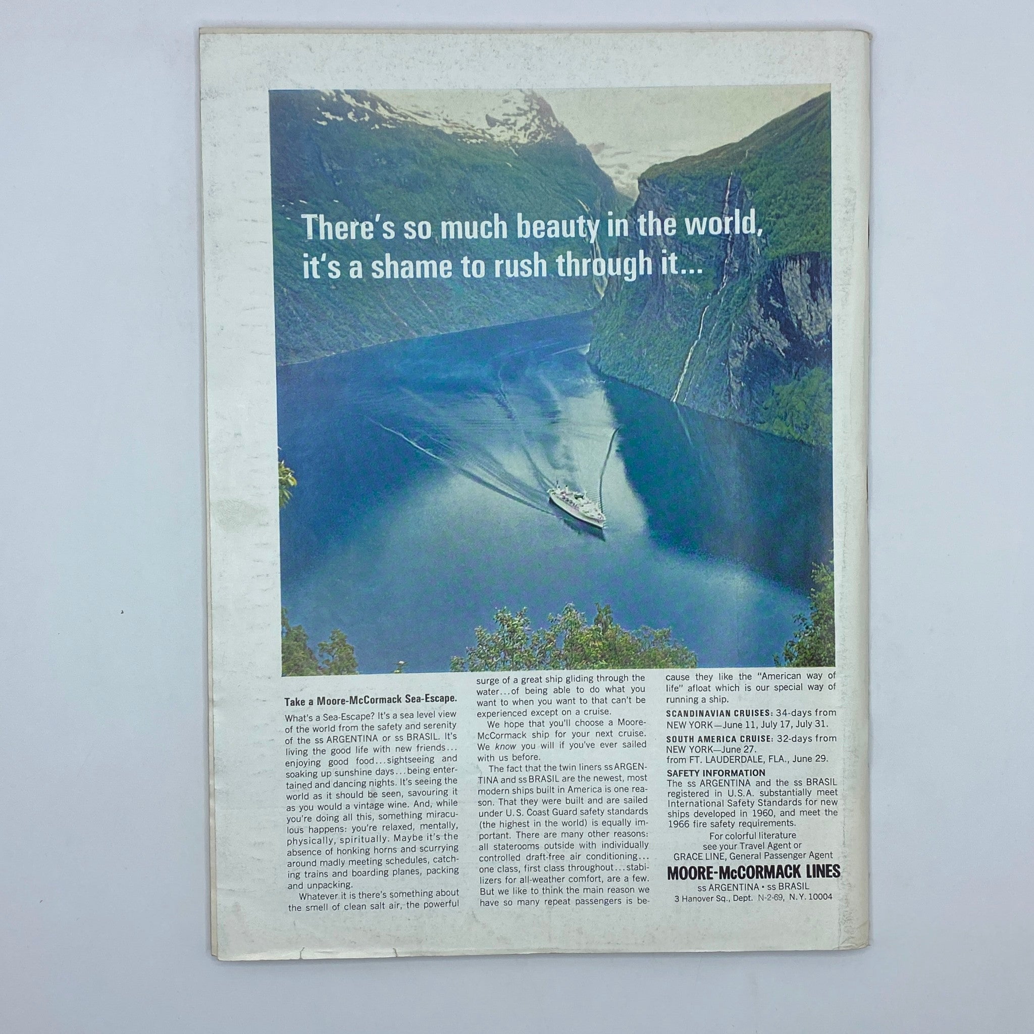 Back cover of The New Yorker magazine from February 22, 1969, showcasing a scenic photo of a ship on a tranquil fjord surrounded by mountains, advertising sea travel.