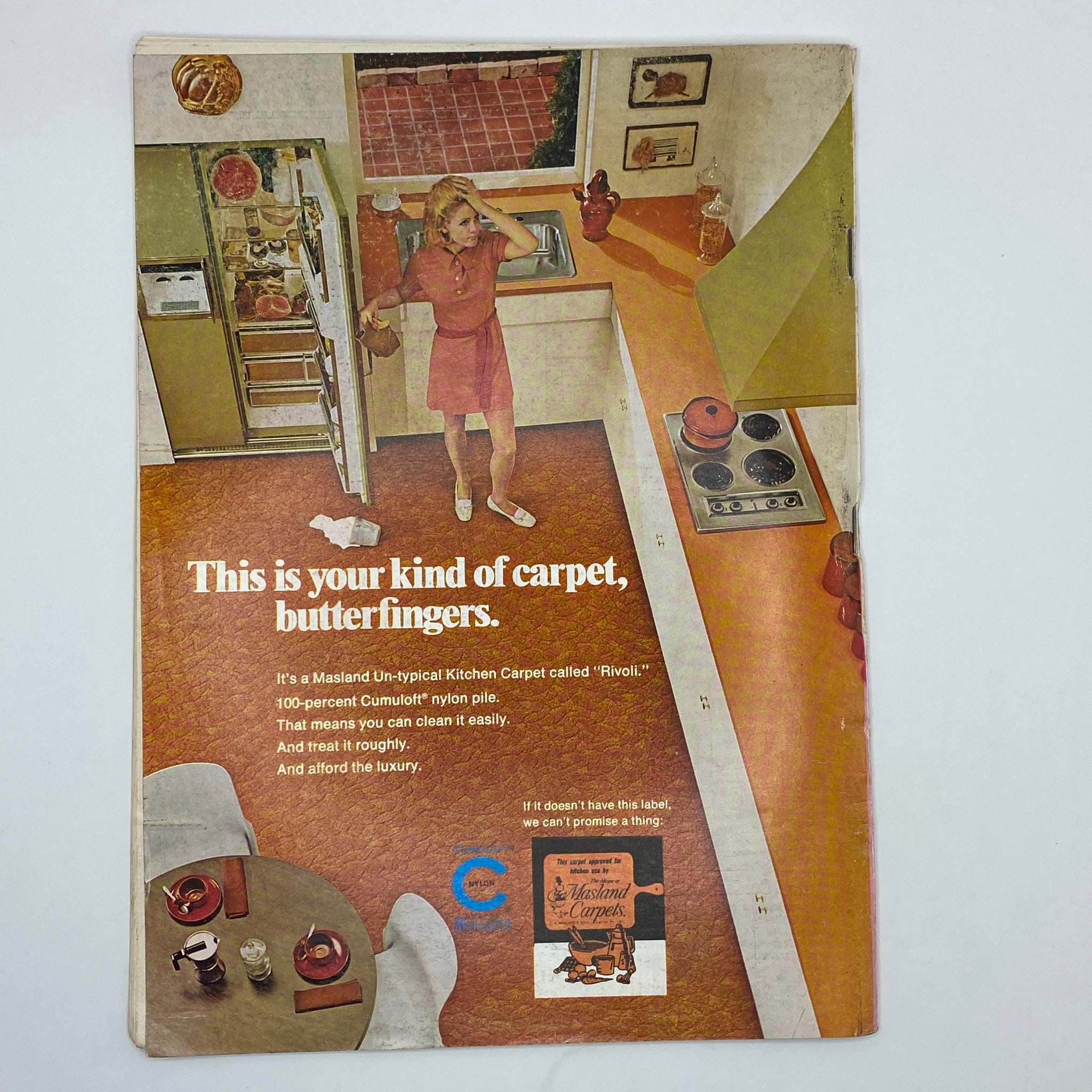 Vintage advertisement for Masland Un-typical Kitchen Carpet from The New Yorker Complete Magazine July 4, 1970, featuring a woman in a kitchen.