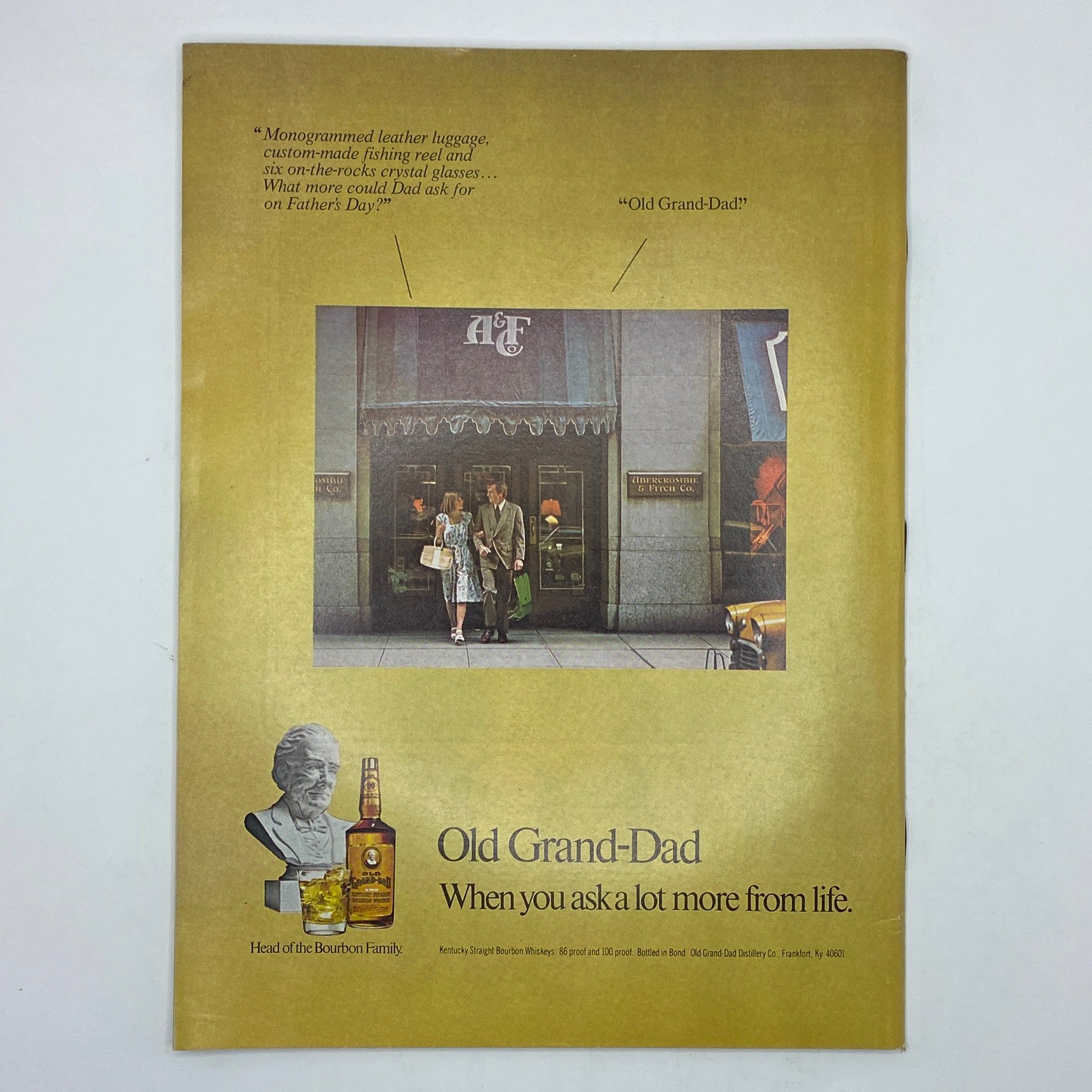 Back cover of The New Yorker Complete Magazine June 6, 1977, featuring an advertisement for Old Grand-Dad bourbon and showcasing a vintage shopping scene.