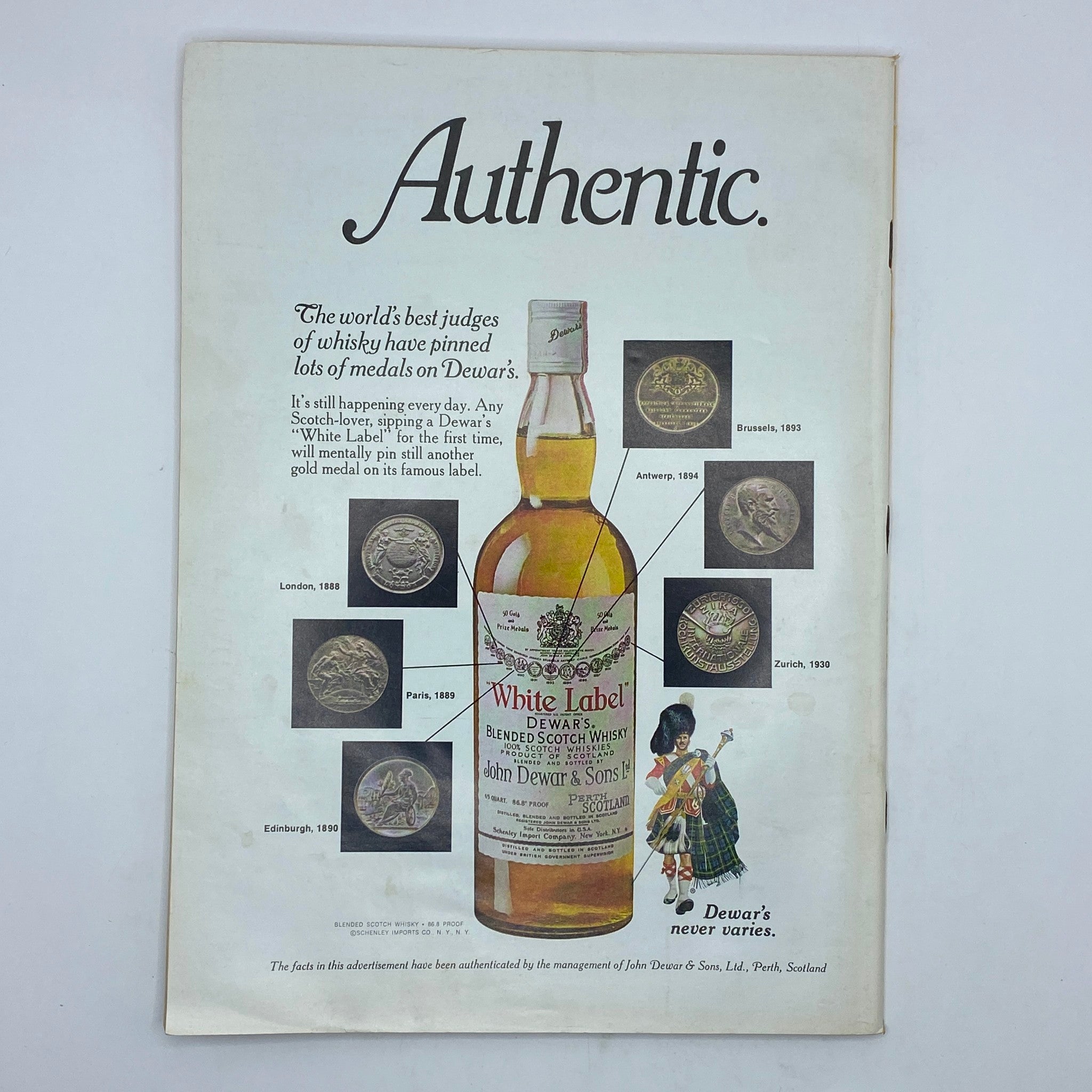 Advertisement page from The New Yorker Complete Magazine April 18, 1977, promoting Dewar's blended Scotch whisky with medal images.