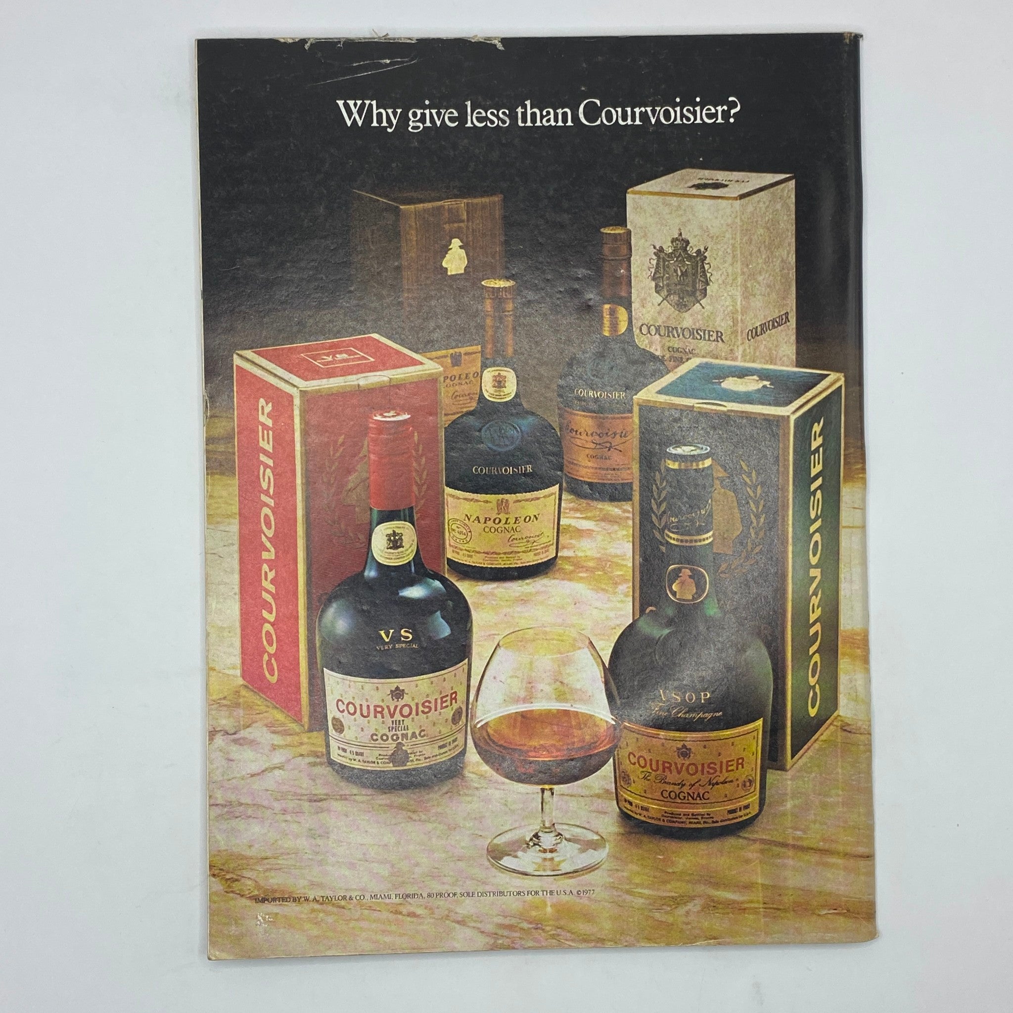 Advertisement page from The New Yorker Magazine December 18, 1978, promoting Courvoisier Cognac with an elegant display of bottles and glass.