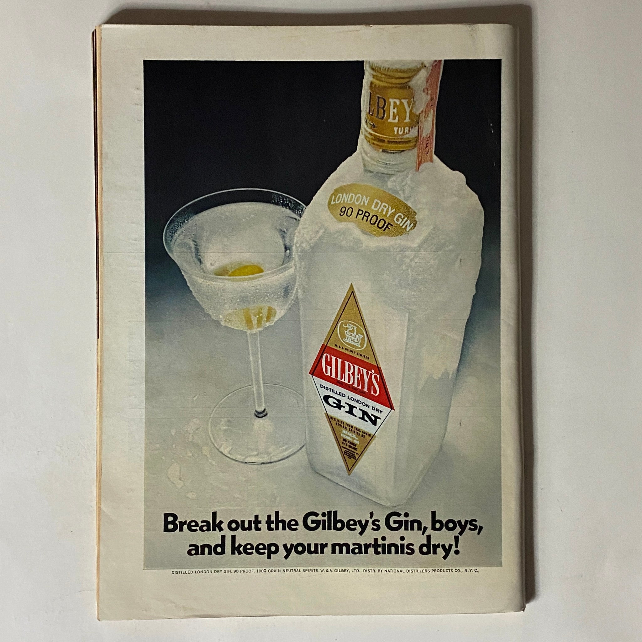 Vintage Gilbey's Gin advertisement featuring a bottle and a martini glass, from The New Yorker magazine, October 8, 1973.
