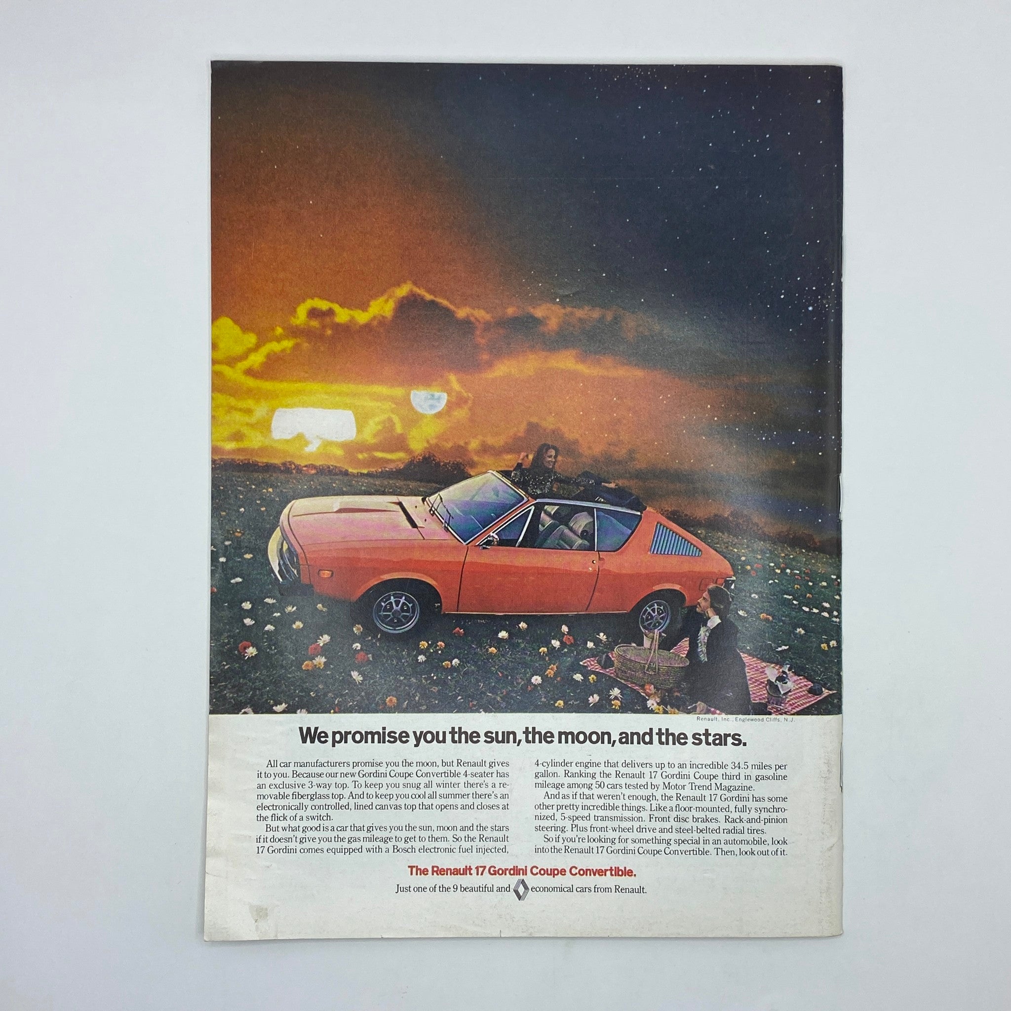 Advertisement page from The New Yorker magazine, July 15, 1974, showcasing the Renault 17 Gordini Coupe Convertible with a picturesque background, promoting the car's features and elegance.
