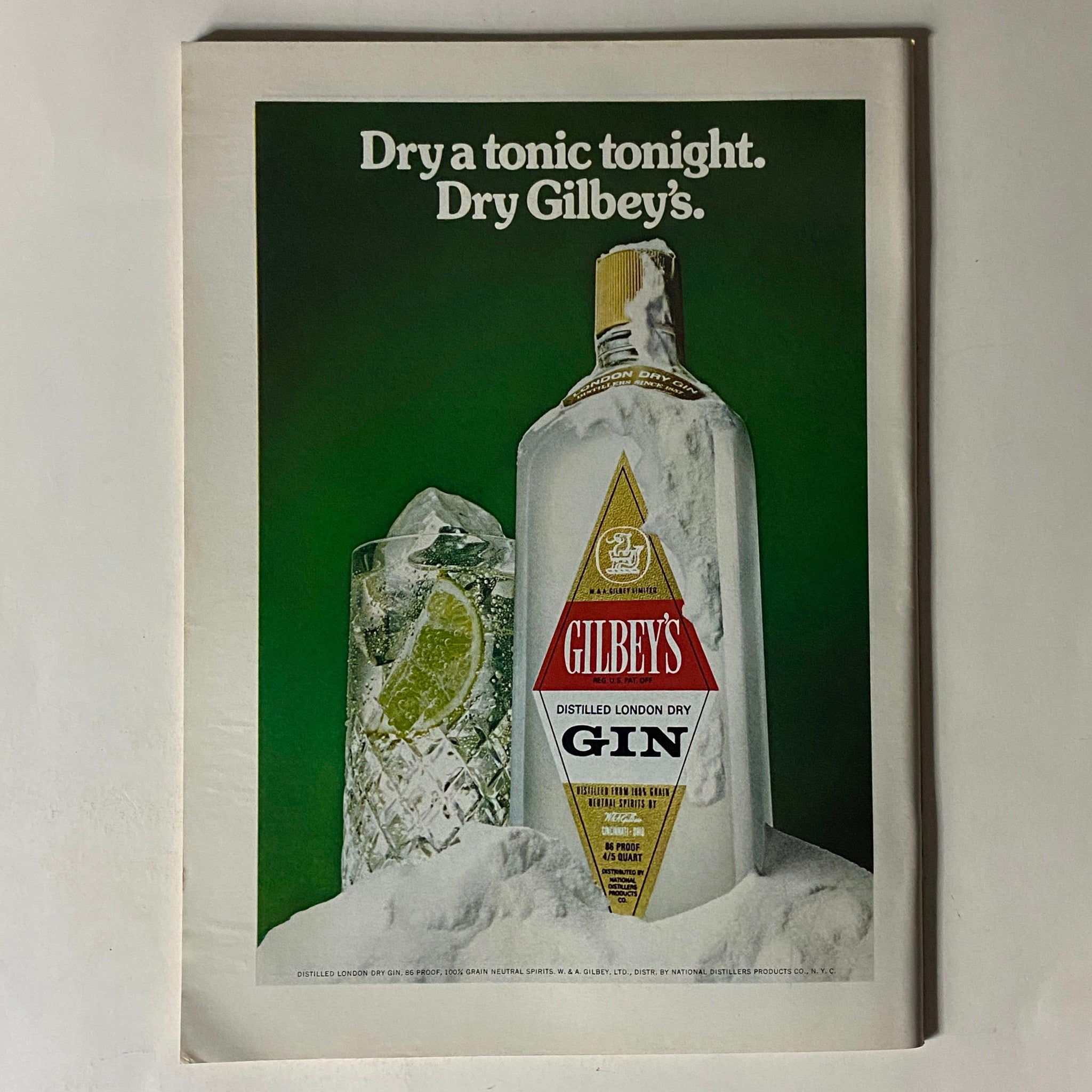 Advertisement page from The New Yorker Complete Magazine July 22, 1974, featuring Gilbey's Dry Gin, illustrating a vintage drink promotion with a bottle and glass.