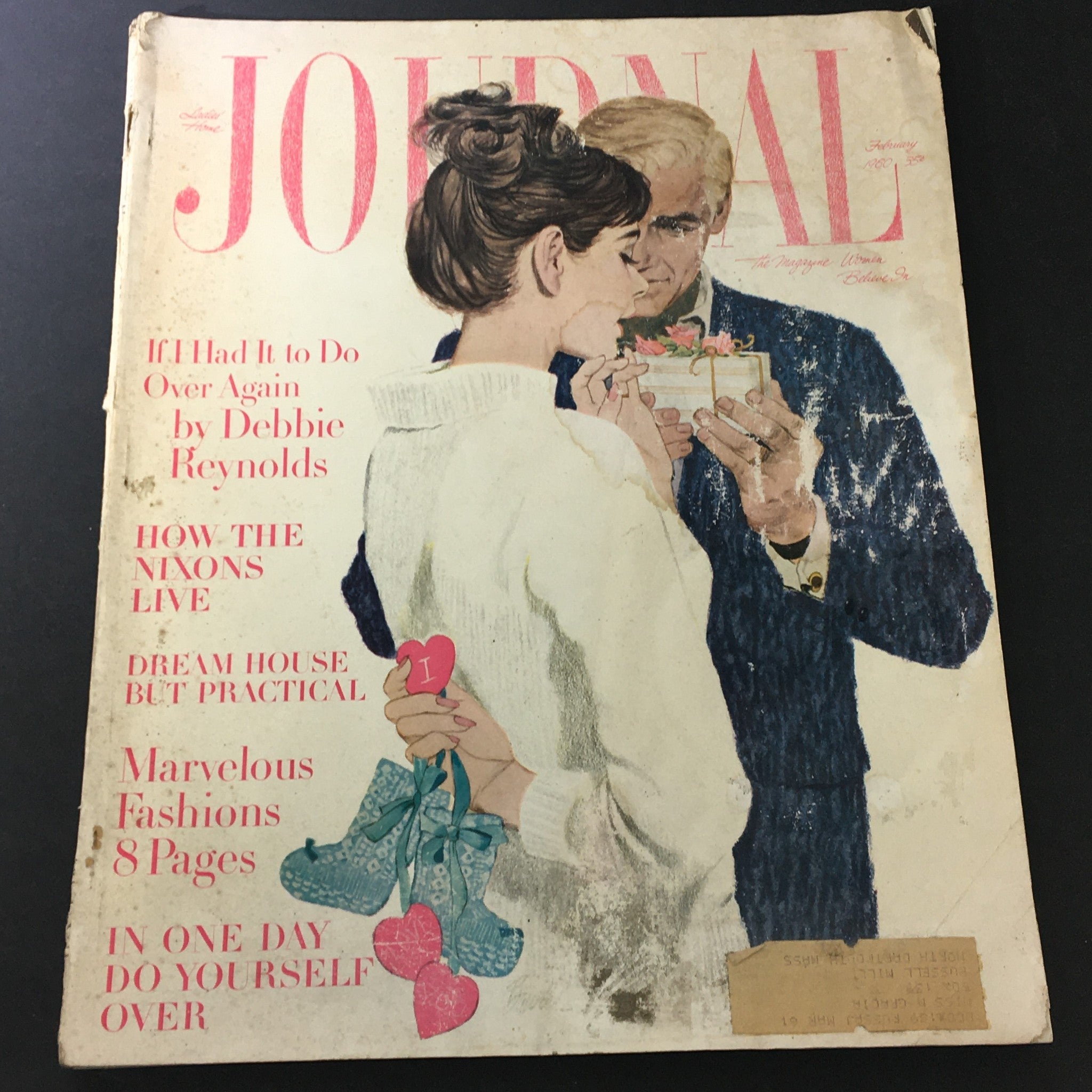 VTG Journal Magazine February 1960 cover featuring an illustration of a couple exchanging gifts, highlighting articles by Debbie Reynolds, the Nixons, and fashion features.