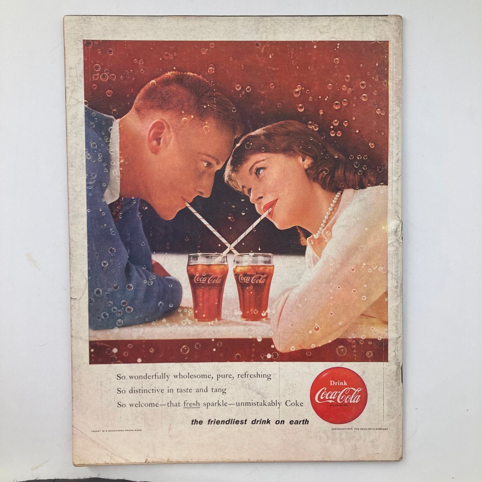 Back cover of VTG Life Magazine January 30 1956, showcasing a vintage Coca-Cola advertisement with a couple sharing drinks.