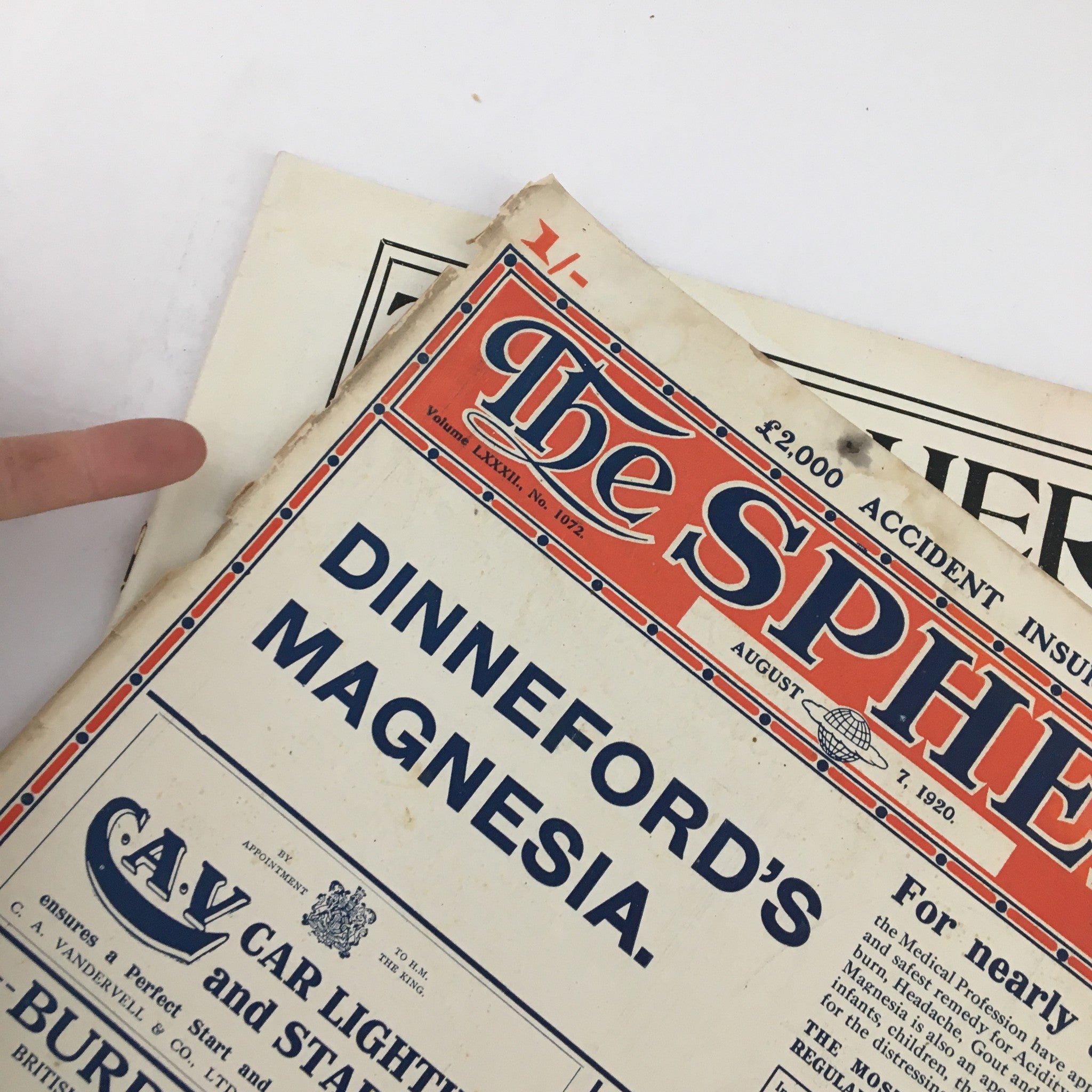 Close-up view of The Sphere Newspaper August 7 1920 showing the advertisement for Dinneford's Magnesia, highlighting vintage design elements.