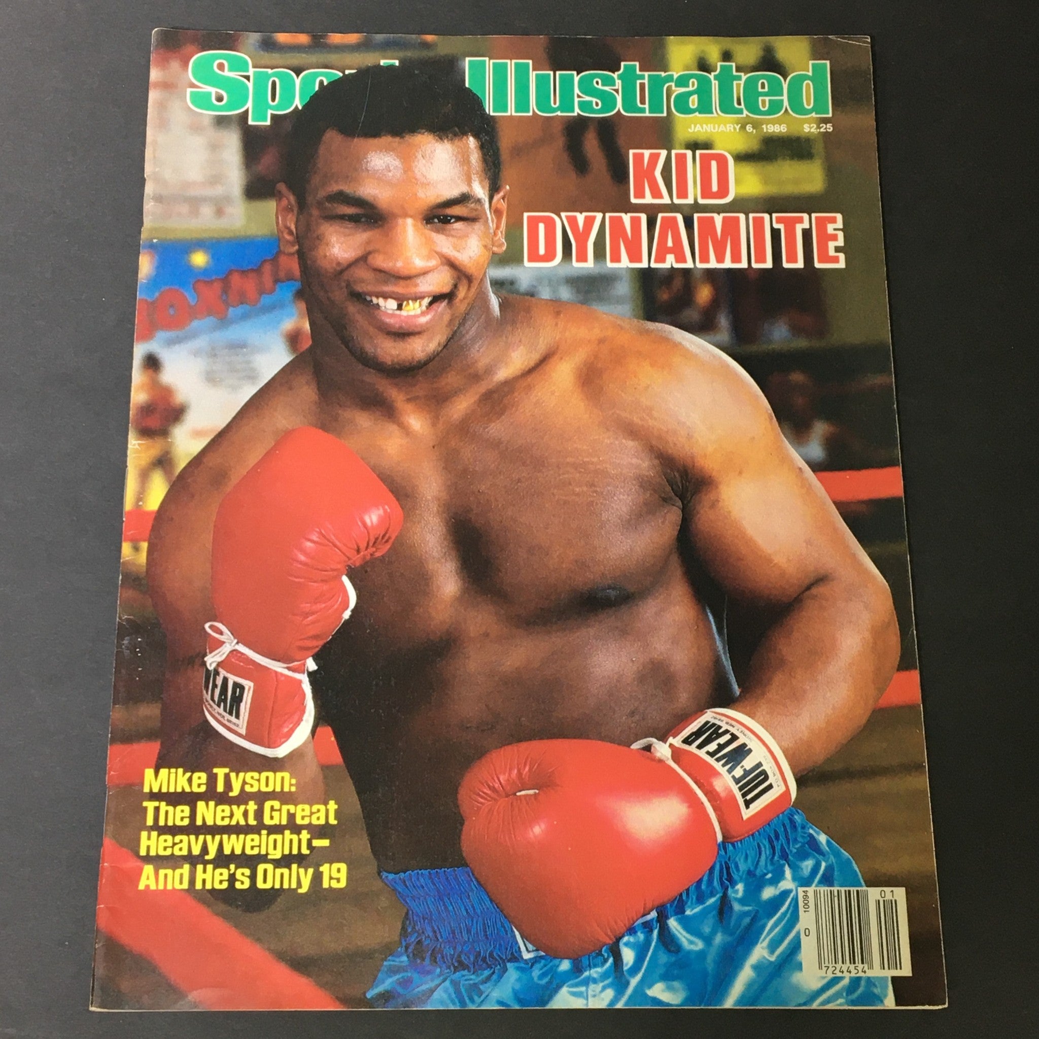 Vintage Sports Illustrated Magazine cover from January 6, 1986 featuring Kid Dynamite Mike Tyson in boxing gloves. The cover highlights Tyson, at just 19 years old, with the title 'Kid Dynamite' and the text discussing him as the next great heavyweight.