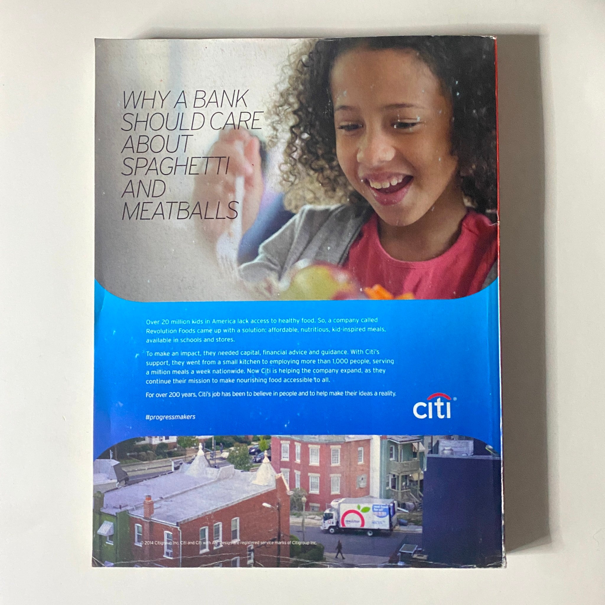 Back cover of Fortune Magazine June 16, 2014 explaining the importance of healthy food access with an engaging image of a smiling child. Ad promotes Citibank's initiative related to community health and social responsibility.