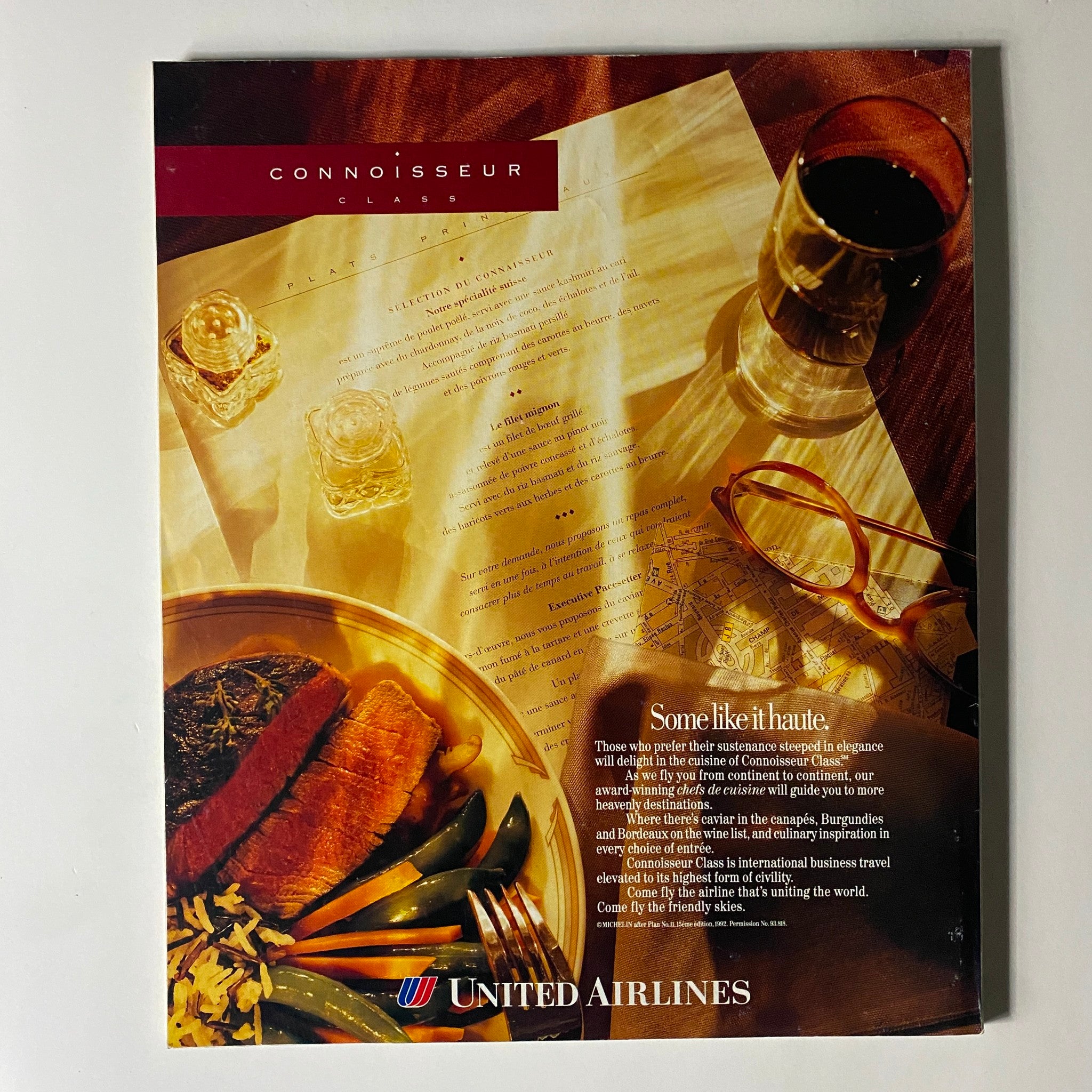 Advertisement from United Airlines promoting Connoisseur Class, featured in Fortune Magazine, October 4, 1993, with a gourmet meal and elegant dining elements.