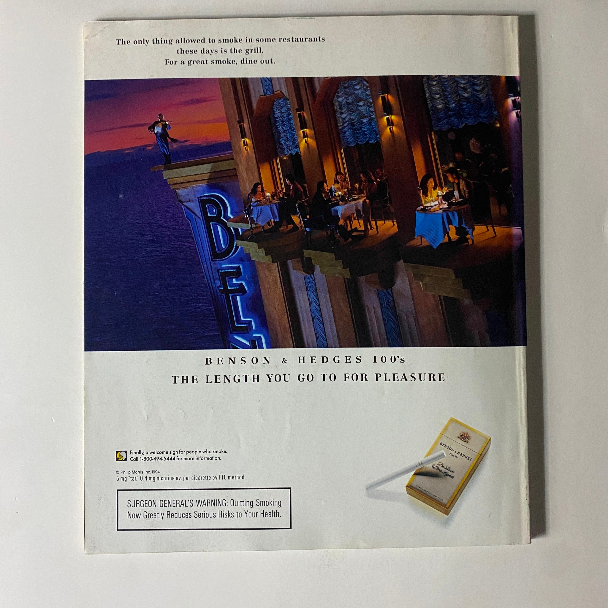 Back cover advertisement for Benson & Hedges 100s cigarettes in Fortune Magazine, October 3, 1994, showcasing a dining scene with a humorous commentary on smoking regulations.
