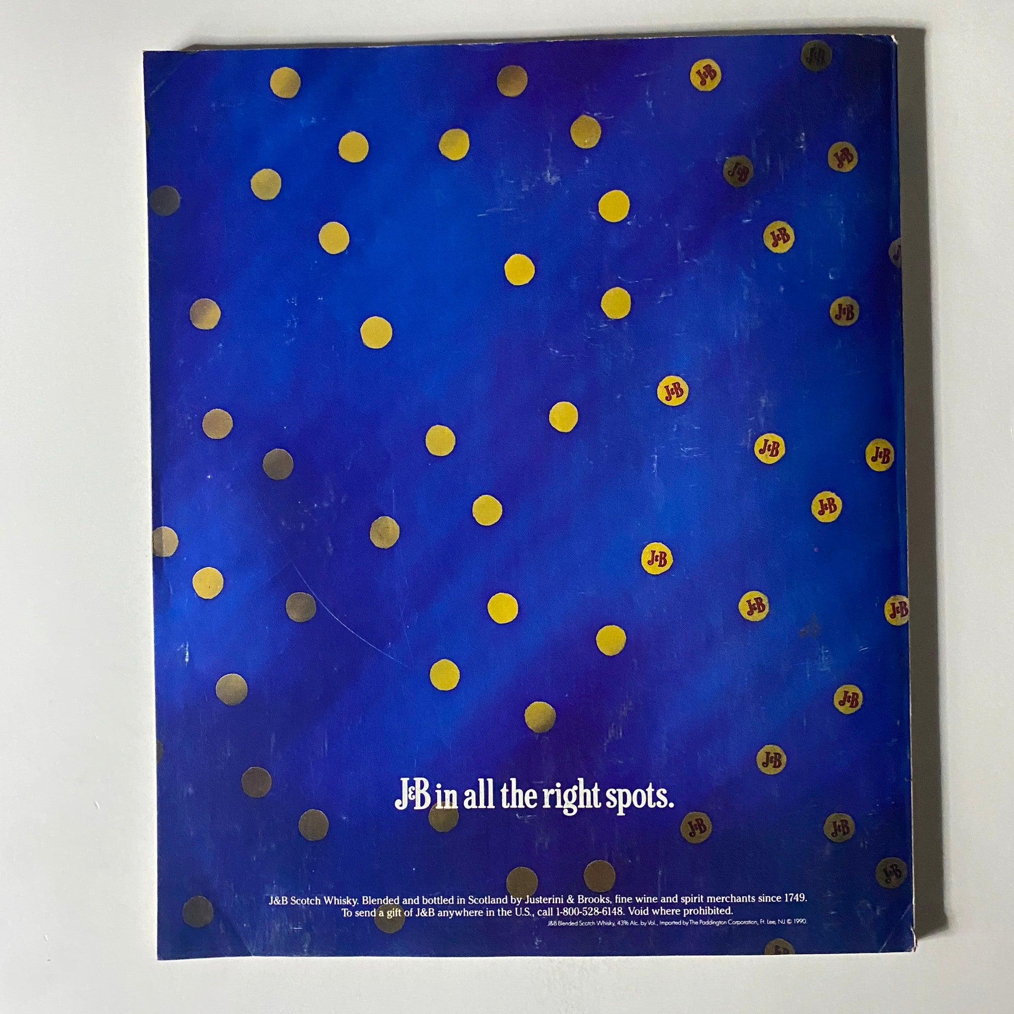Back cover of Fortune Magazine from May 7, 1990, displaying a colorful advertisement for J&B Scotch Whisky with the tagline 'J&B in all the right spots.'