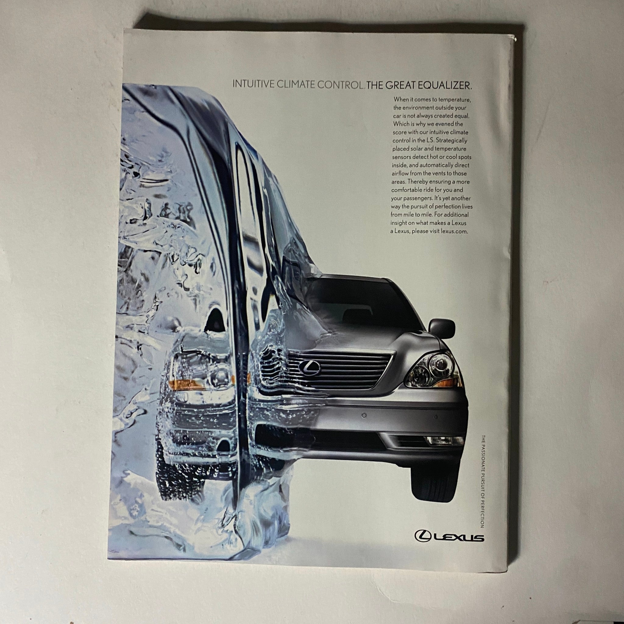 Lexus advertisement showcasing intuitive climate control, featuring a sleek car design and artistic imagery, linked to Fortune Magazine August 22, 2005.