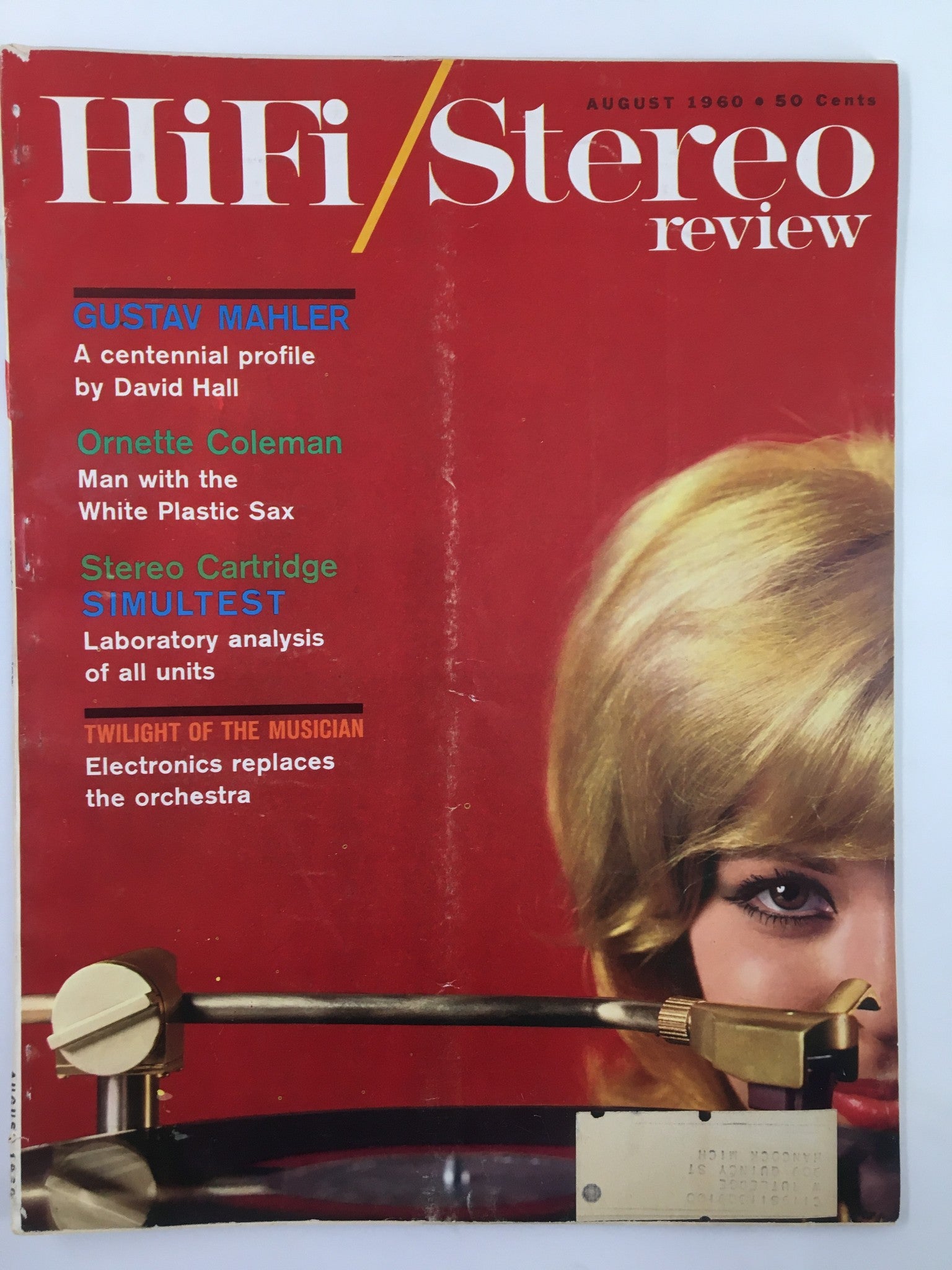 Cover of the VTG HiFi/Stereo Review Magazine from August 1960, featuring highlights on Gustav Mahler and Ornette Coleman, with vibrant red background and an image of a woman beside a turntable.