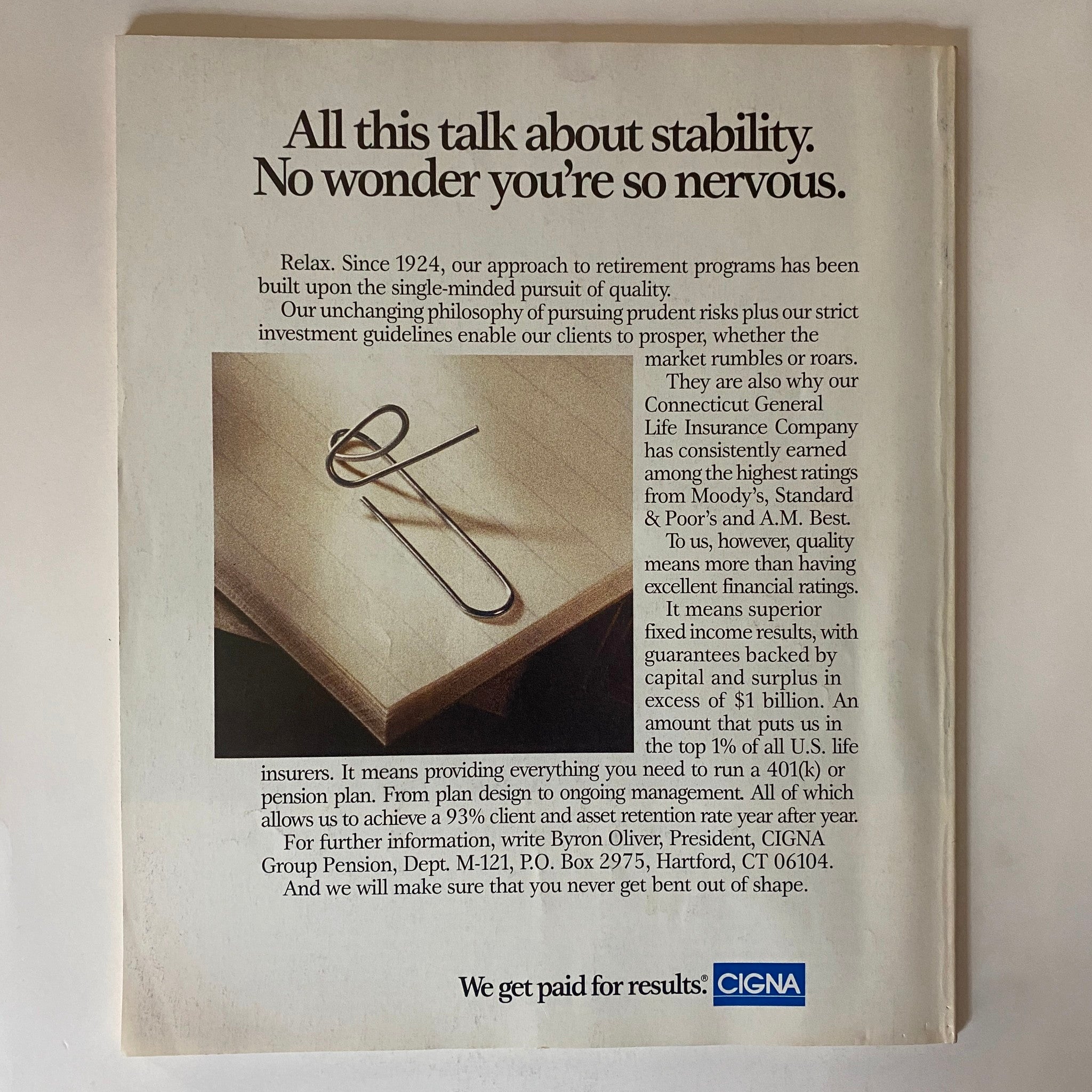 Fortune Magazine January 25, 1993 advertisement discussing retirement programs by CIGNA, featuring a paperclip on a desk, emphasizing quality and stability in financial planning.