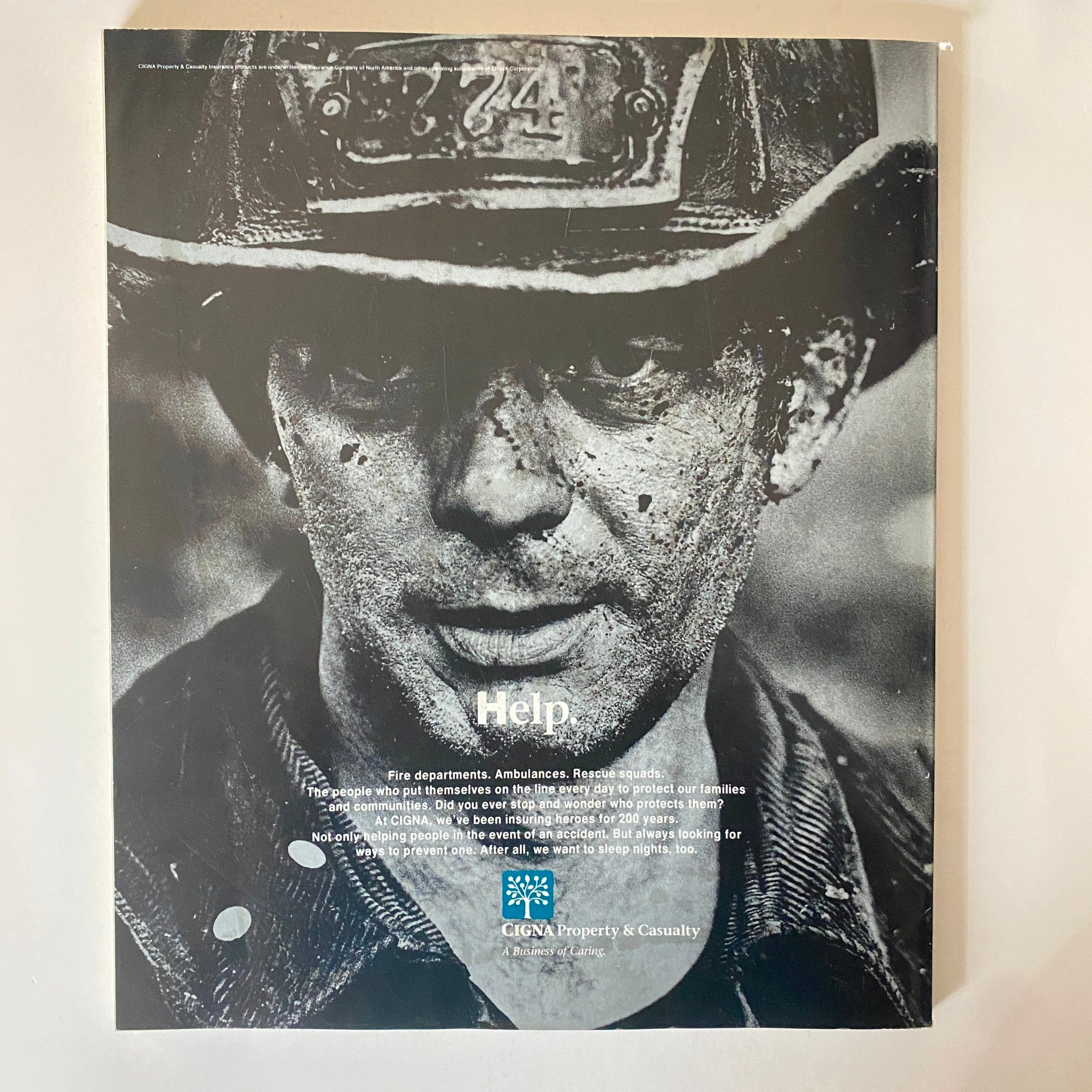 Back cover of Fortune Magazine December 26, 1994, showcasing an advertisement for CIGNA Property & Casualty, highlighting themes of community and protection.