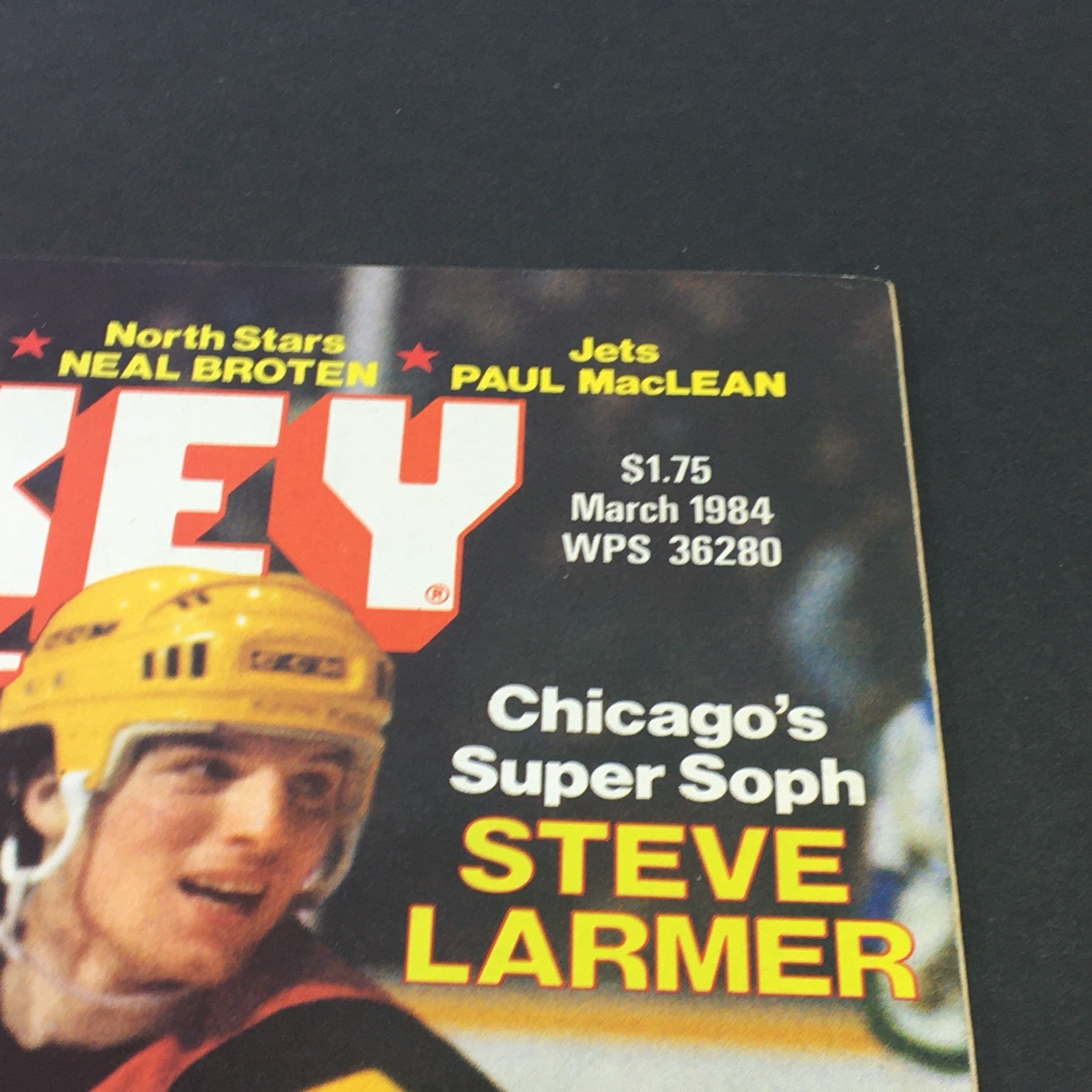 Close-up of the March 1984 Hockey Illustrated magazine cover highlighting Chicago’s Steve Larmer and details about NHL players, including Neal Broten and Paul MacLean.