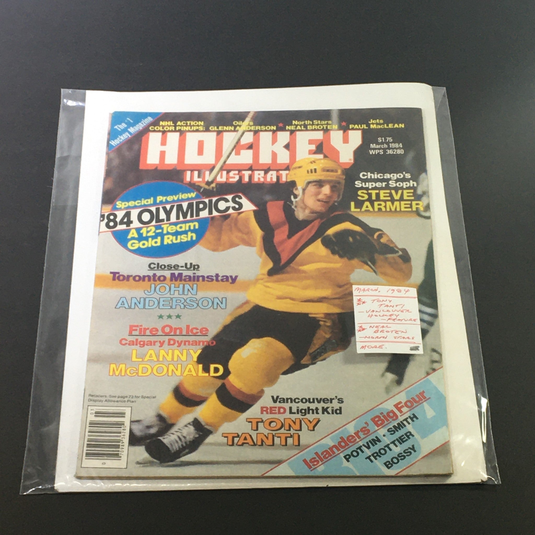 March 1984 issue of Hockey Illustrated magazine encapsulated in protective plastic, featuring a vibrant cover with Tony Tanti, details on the 1984 Olympics, and key NHL articles.