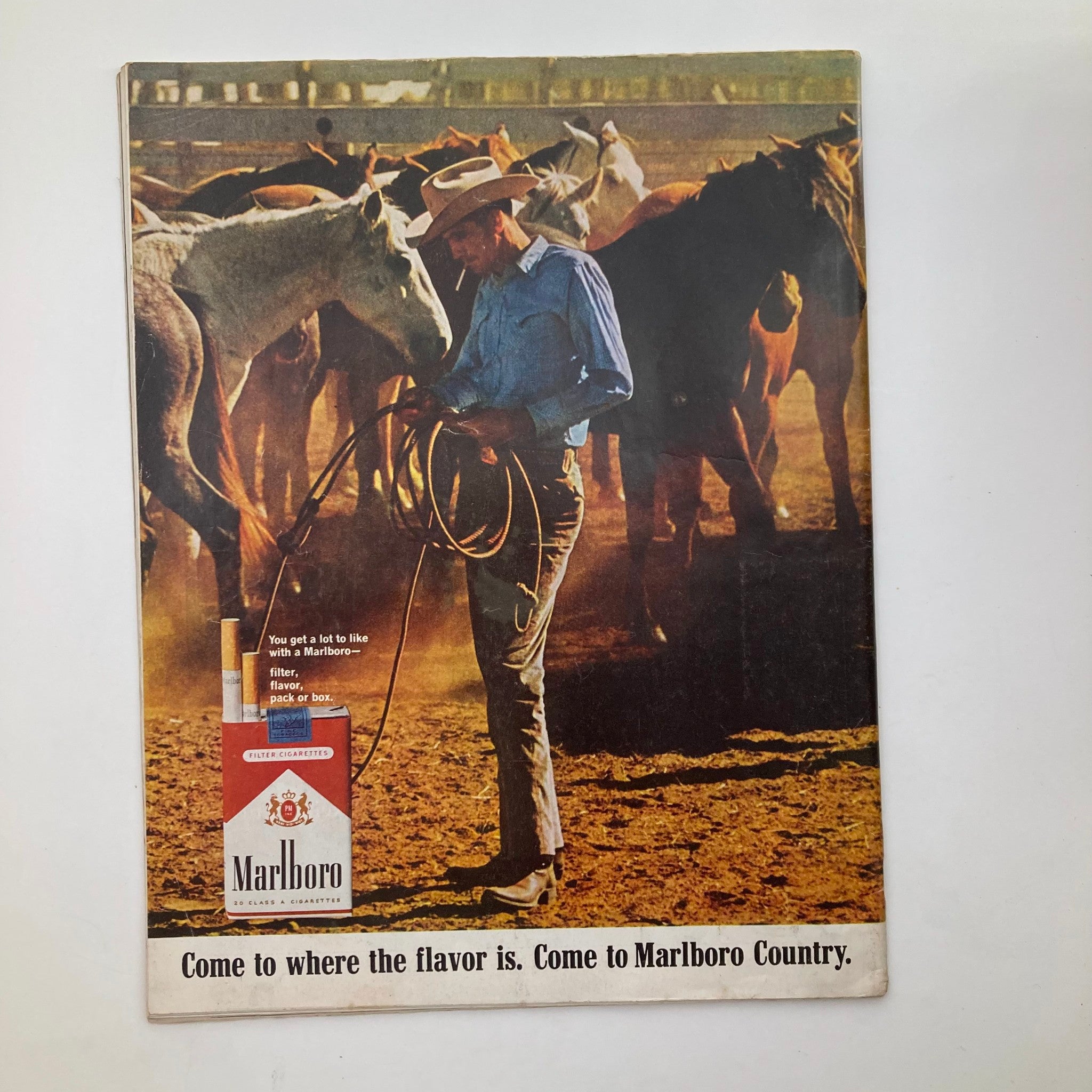 Back cover of The Saturday Evening Post Magazine, April 23, 1966, featuring a Marlboro advertisement with a cowboy, reflecting the advertising style and culture of the 1960s.