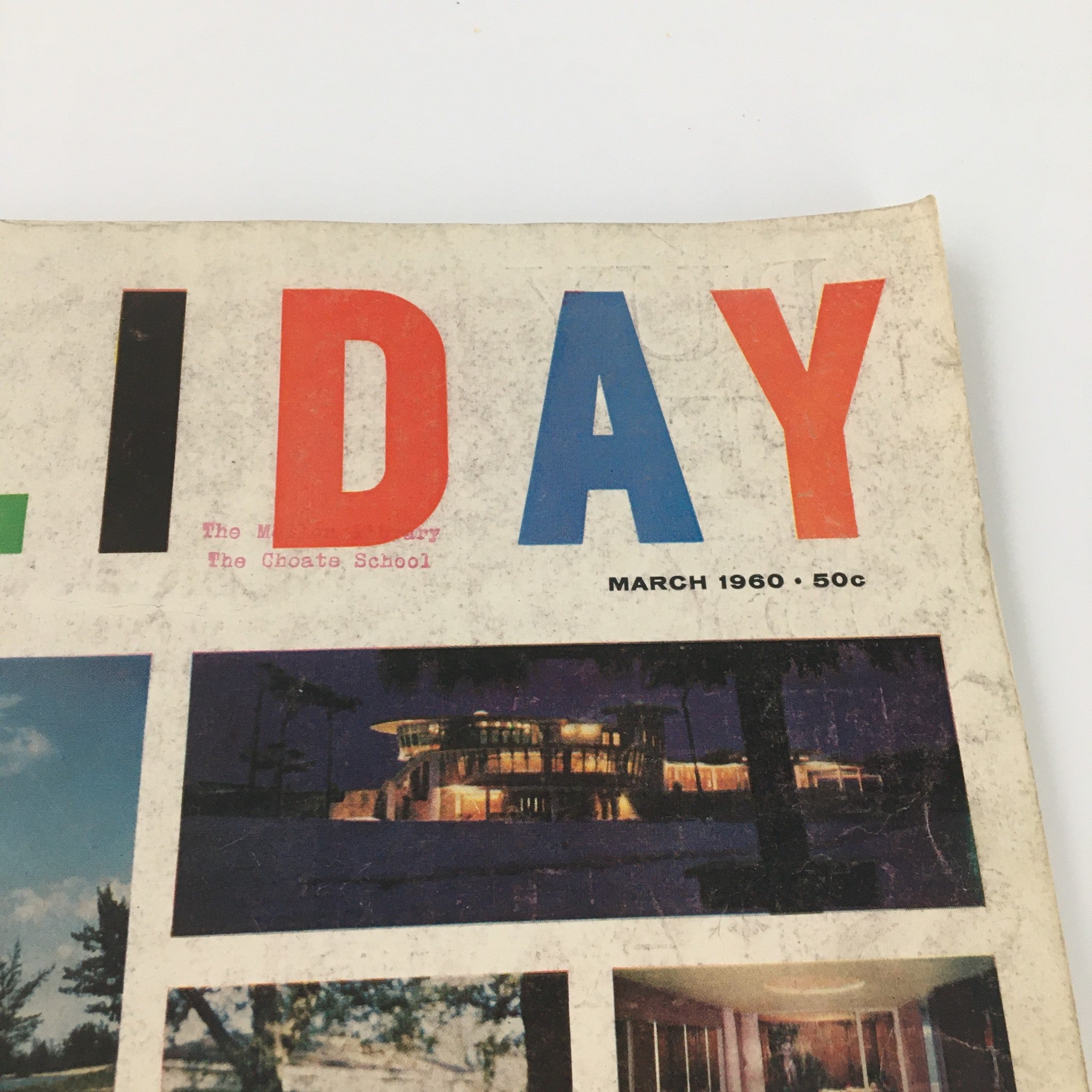 Close-up view of the Vintage Holiday Magazine March 1960 cover highlighting the colorful title and date, demonstrating its retro appeal.
