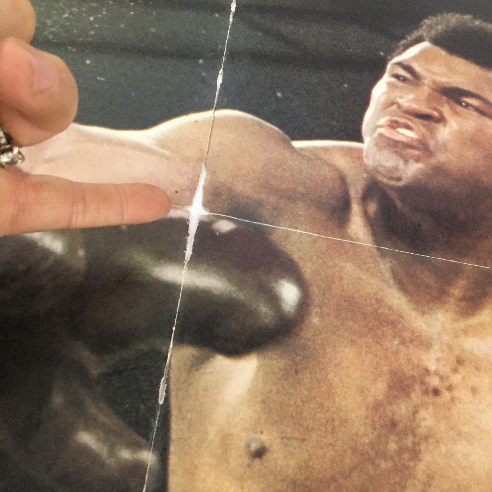 Close-up detail of the VTG 1975 Muhammad Ali Giant Poster Magazine highlighting an iconic moment with Muhammad Ali in action, focusing on the texture and design of the magazine.
