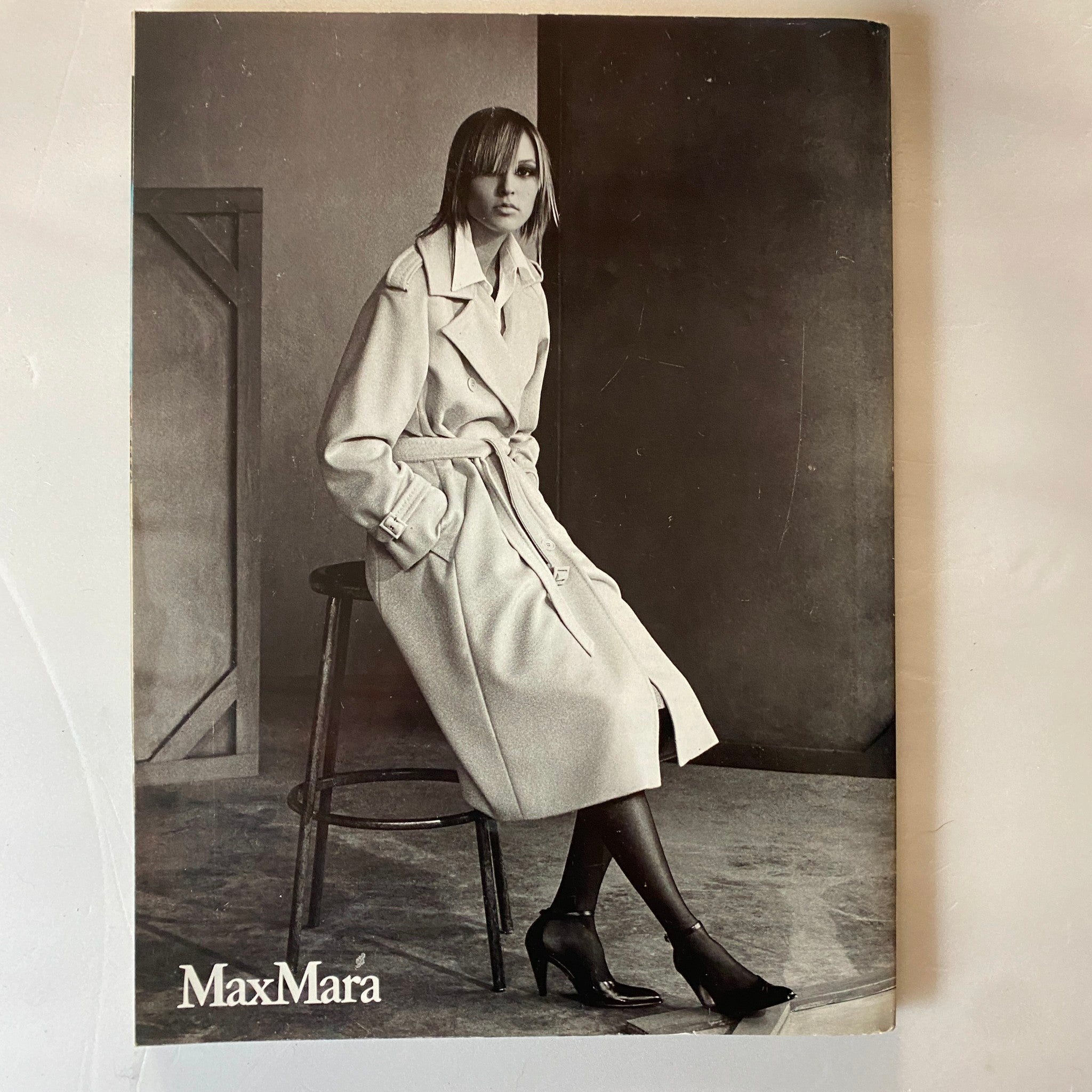 Fashion advertisement featured in Harpers & Queen British Edition Magazine October 2001, displaying a model in a MaxMara coat.