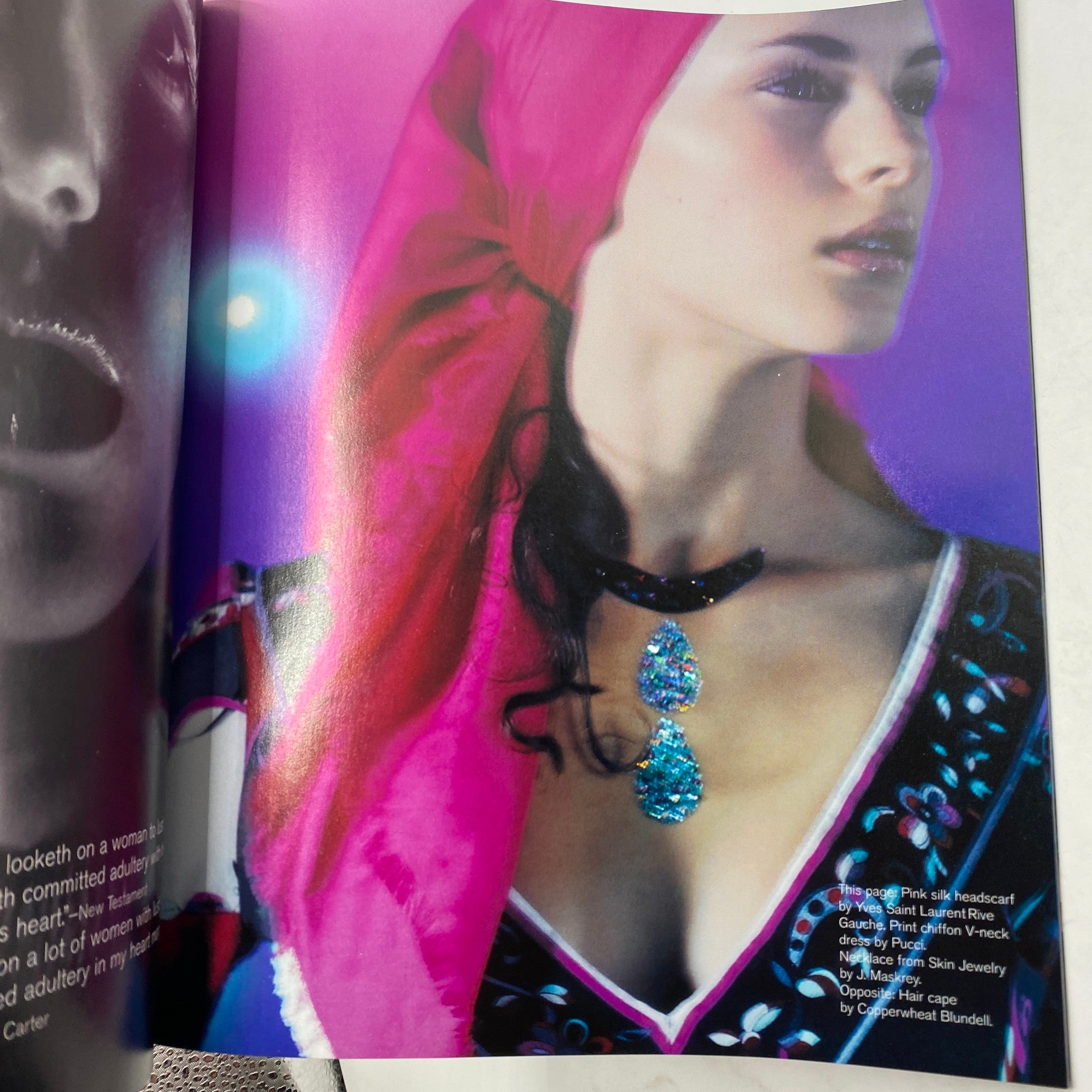Fashion editorial page from Nylon Magazine November - December 1999, featuring a model adorned with vibrant jewelry and clothing, reflecting late 90s fashion trends.