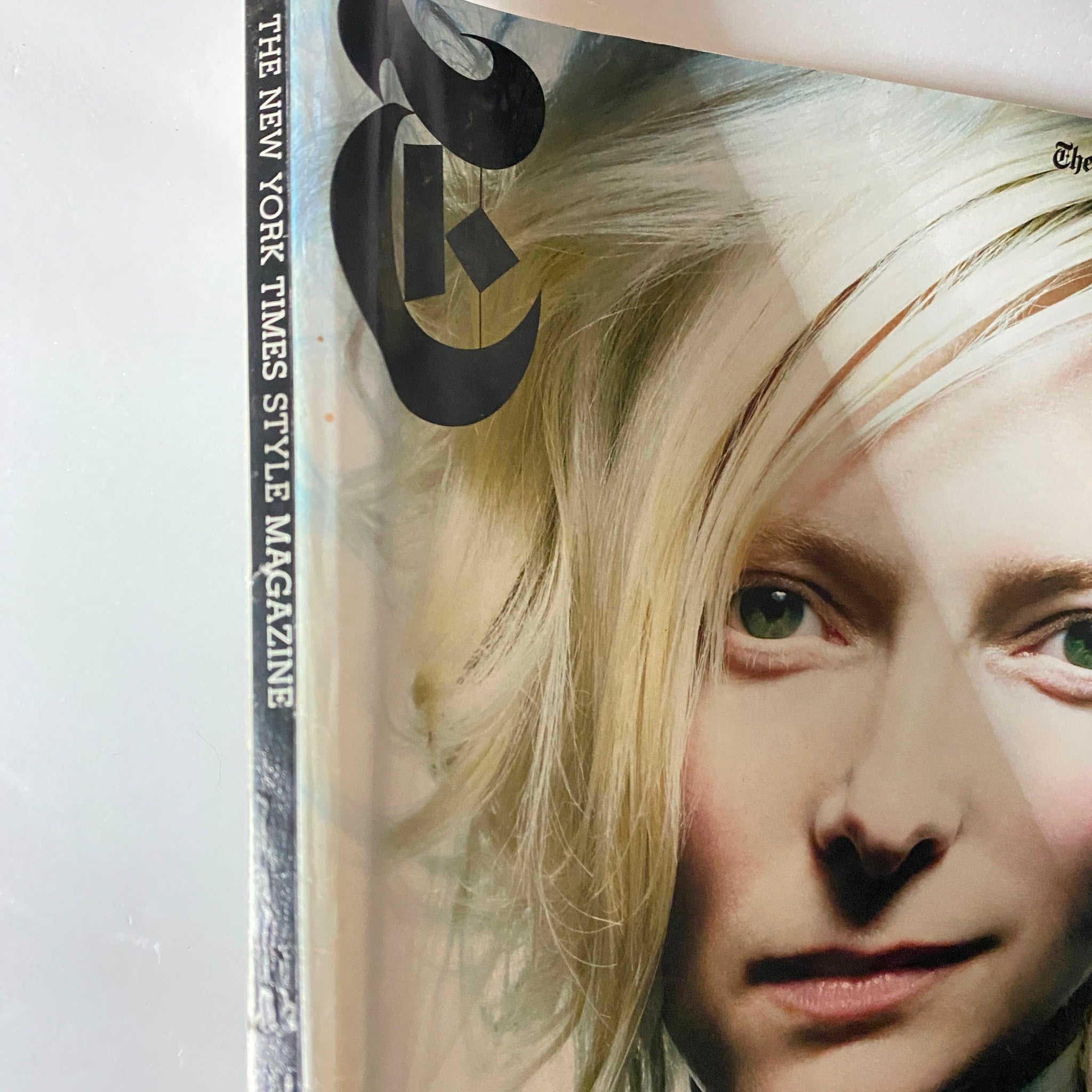 Close-up view of The New York Times Style Magazine 2005 cover featuring Tilda Swinton, highlighting her captivating expression and the magazine's branding.