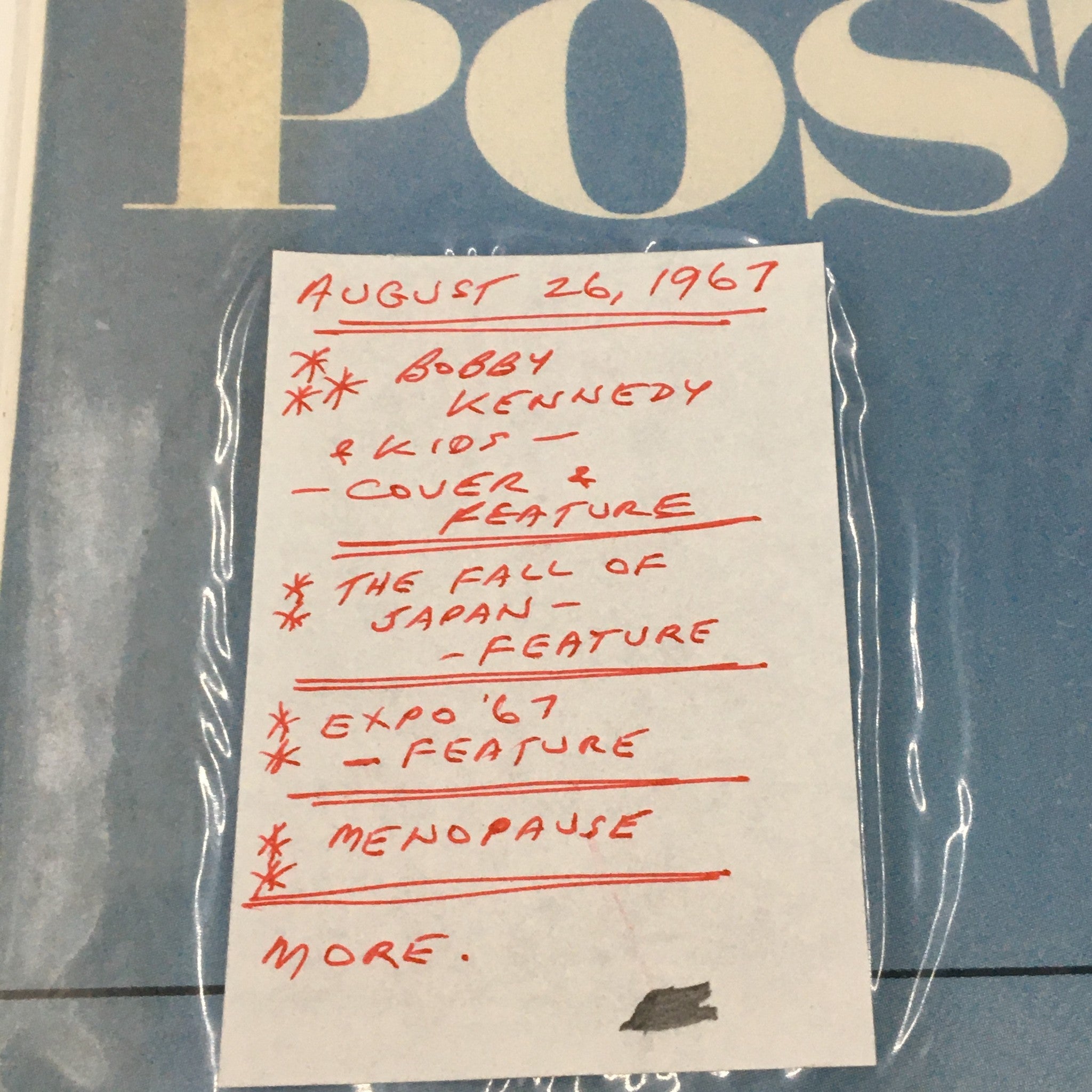 A detailed note attached to The Saturday Evening Post magazine dated August 26, 1967, featuring Bobby Kennedy and kids on the cover. The note outlines cover and feature stories including 'The Fall of Japan', 'Expo 67', and 'Menopause', highlighting the magazine's historical context.