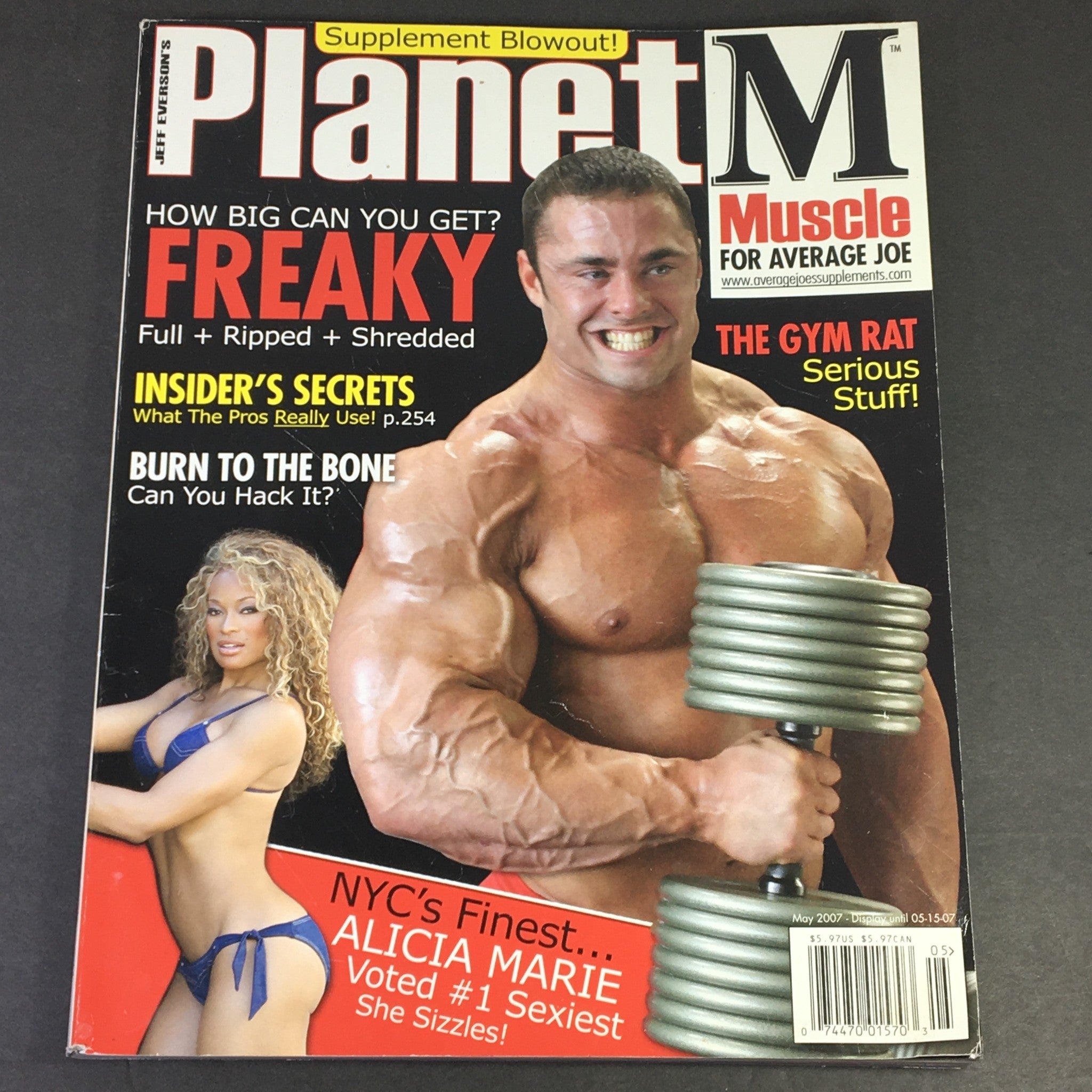 Cover of Planet Muscle Magazine May 2007 featuring Alicia Marie and The Gym Rat Serious Staff, showcasing a muscular model with weights, highlighting fitness culture and bodybuilding visuals from the mid-2000s.
