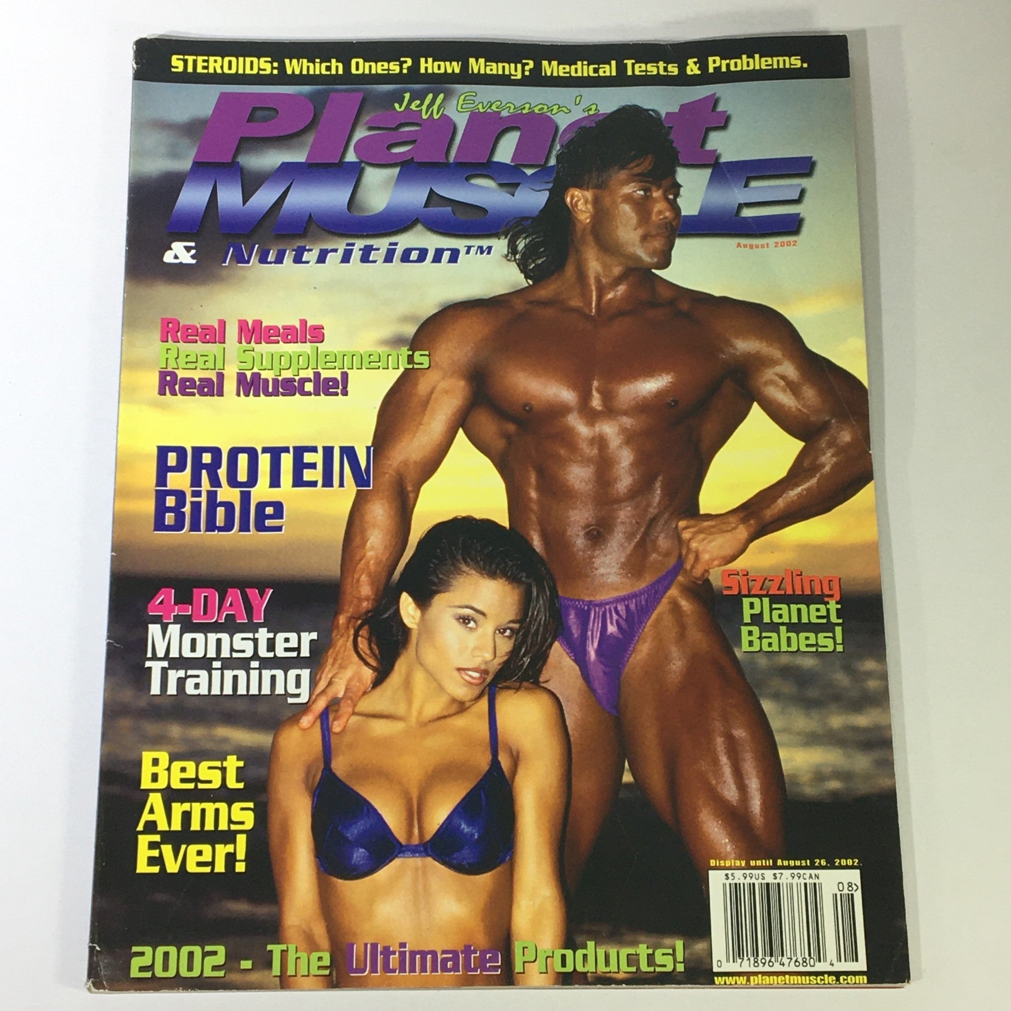 Planet Muscle & Nutrition Magazine August 2002 cover featuring a muscular male bodybuilder and a female model, highlighting topics such as Protein Bible and Monster Training.