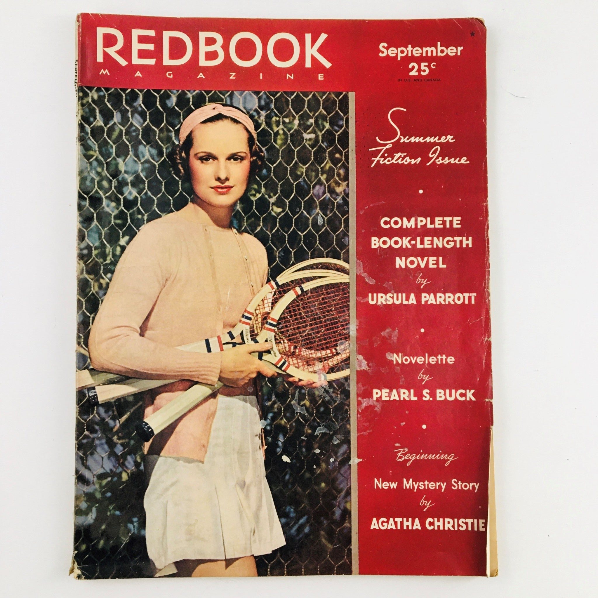 Cover of Redbook Magazine September 1936, featuring a woman with tennis racquets, highlighting the themed Summer Fiction Issue. This issue covers the Run, Hits and Errors of the New Deal.
