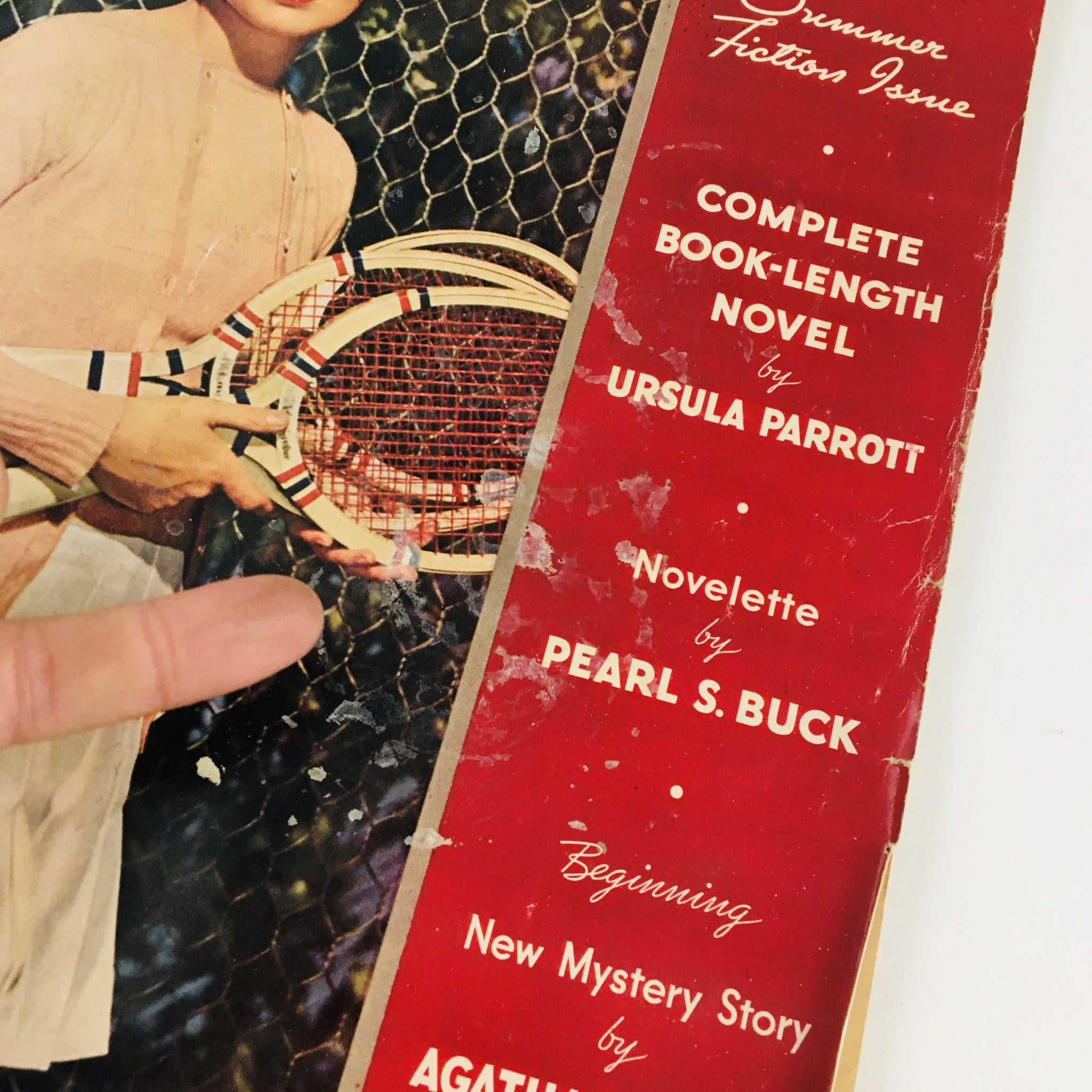 Cover of Redbook Magazine September 1936, featuring a vintage tennis theme and highlighting works by Ursula Parrott and Pearl S. Buck, emphasizing the publication's focus on fictional narratives.