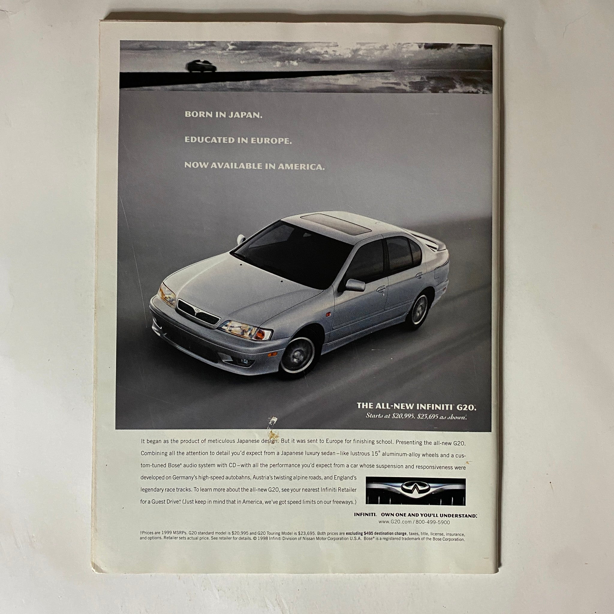 Back cover of Tennis Magazine, October 1998, Vol 34 No. 6 featuring an advertisement for the all-new Infiniti G20, emphasizing its luxury and performance.