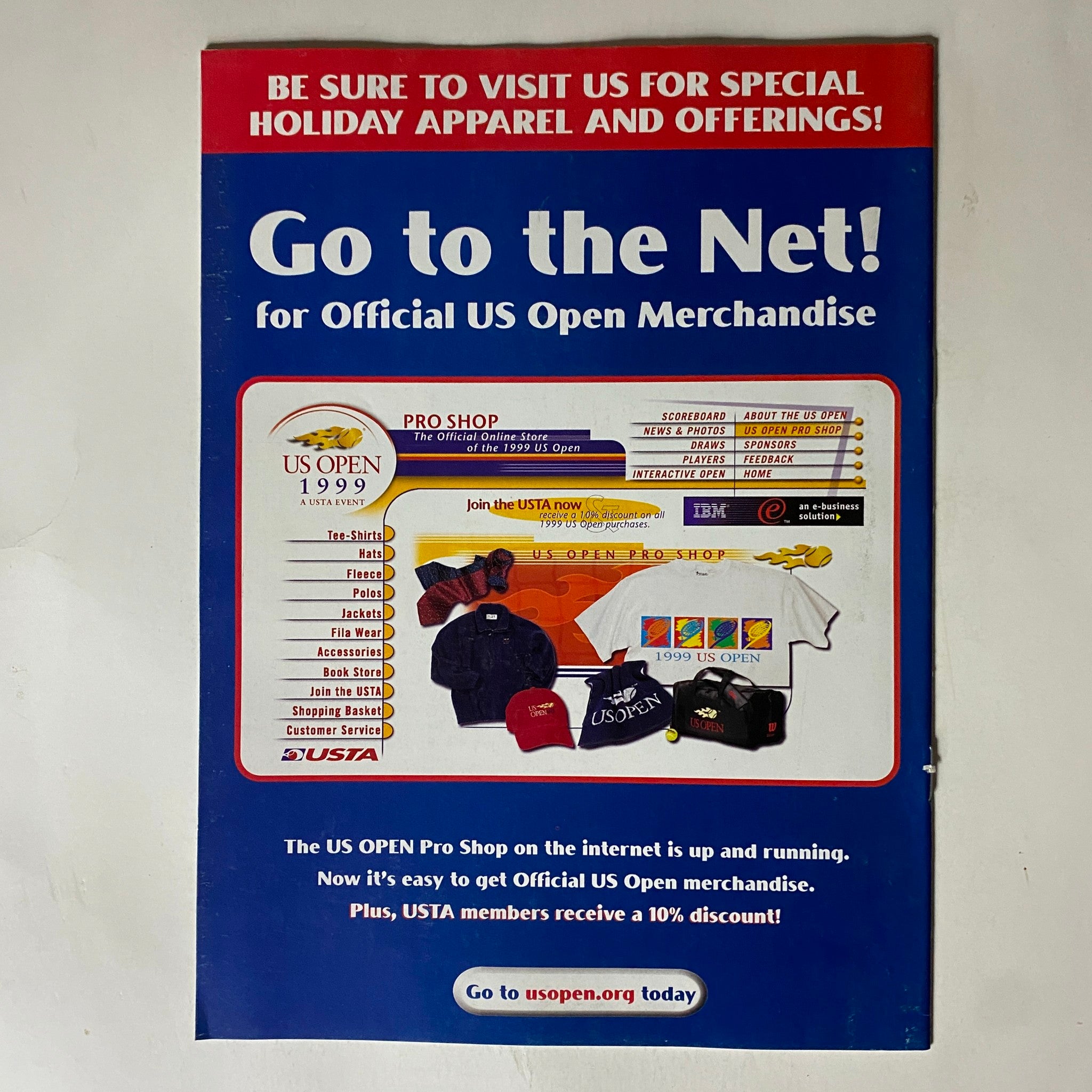 Go to the Net! Advertisement for Official US Open Merchandise featuring various US Open items including apparel and accessories, from the USTA Tennis Magazine December 1999 issue with Andre Agassi on the cover.